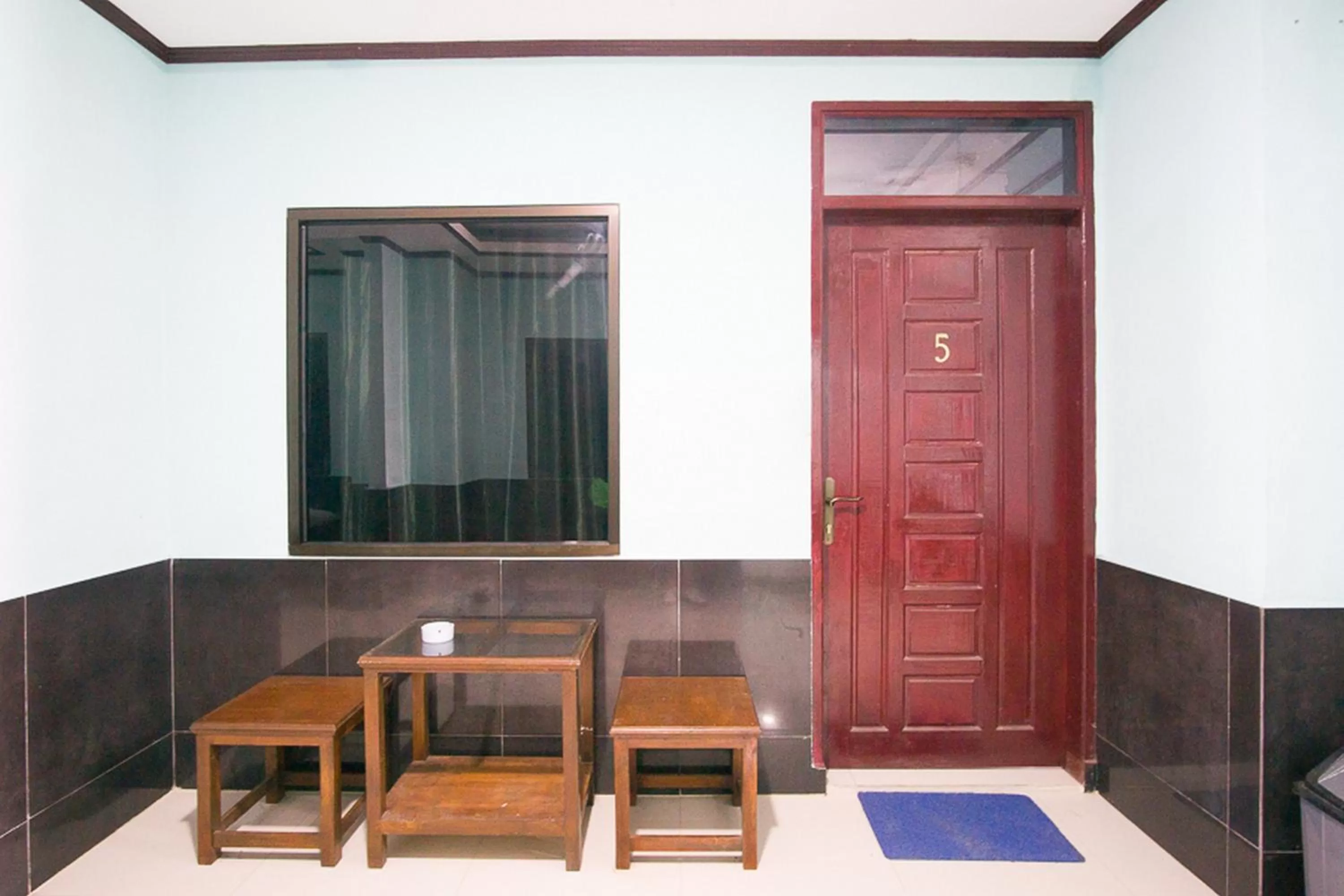 Facade/entrance in RedDoorz near Mikie Holiday Funland Berastagi