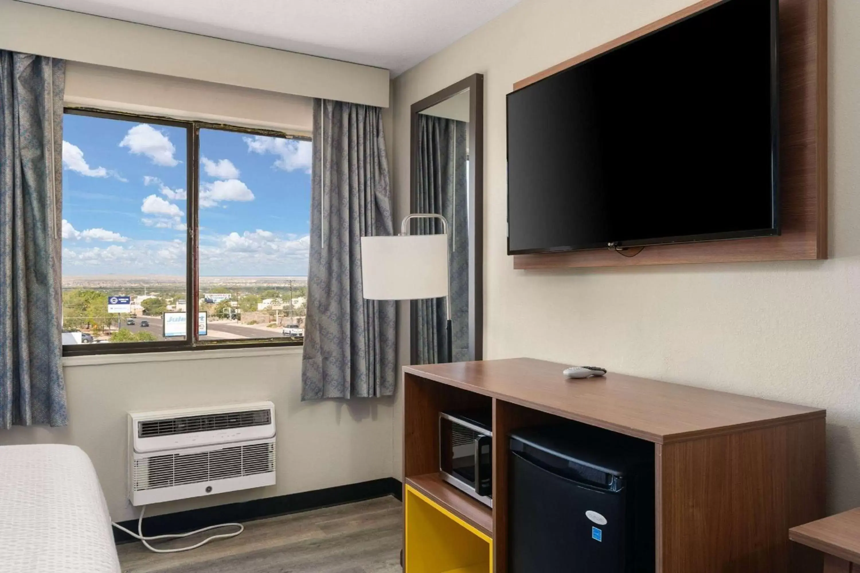 Photo of the whole room, TV/Entertainment Center in Days Inn by Wyndham Albuquerque I-25