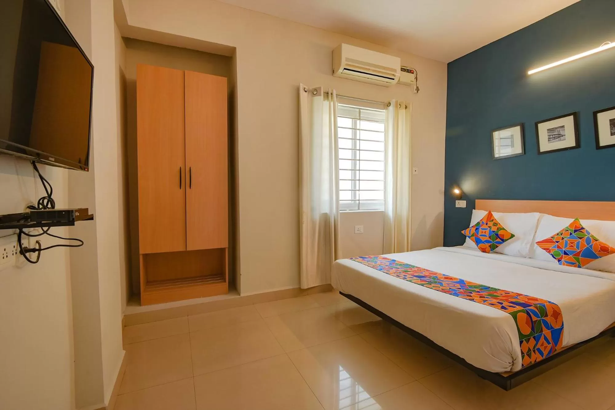 Bed in FabHotel Sasti Inn