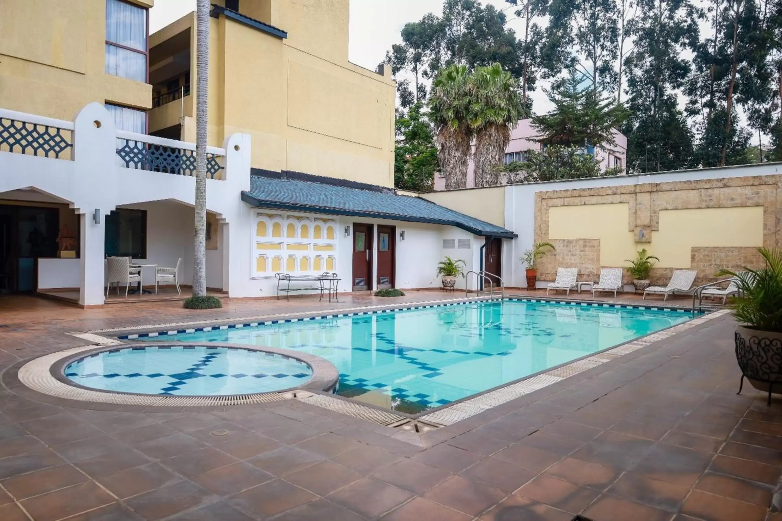 Swimming pool, Property Building in The Heron Hotel