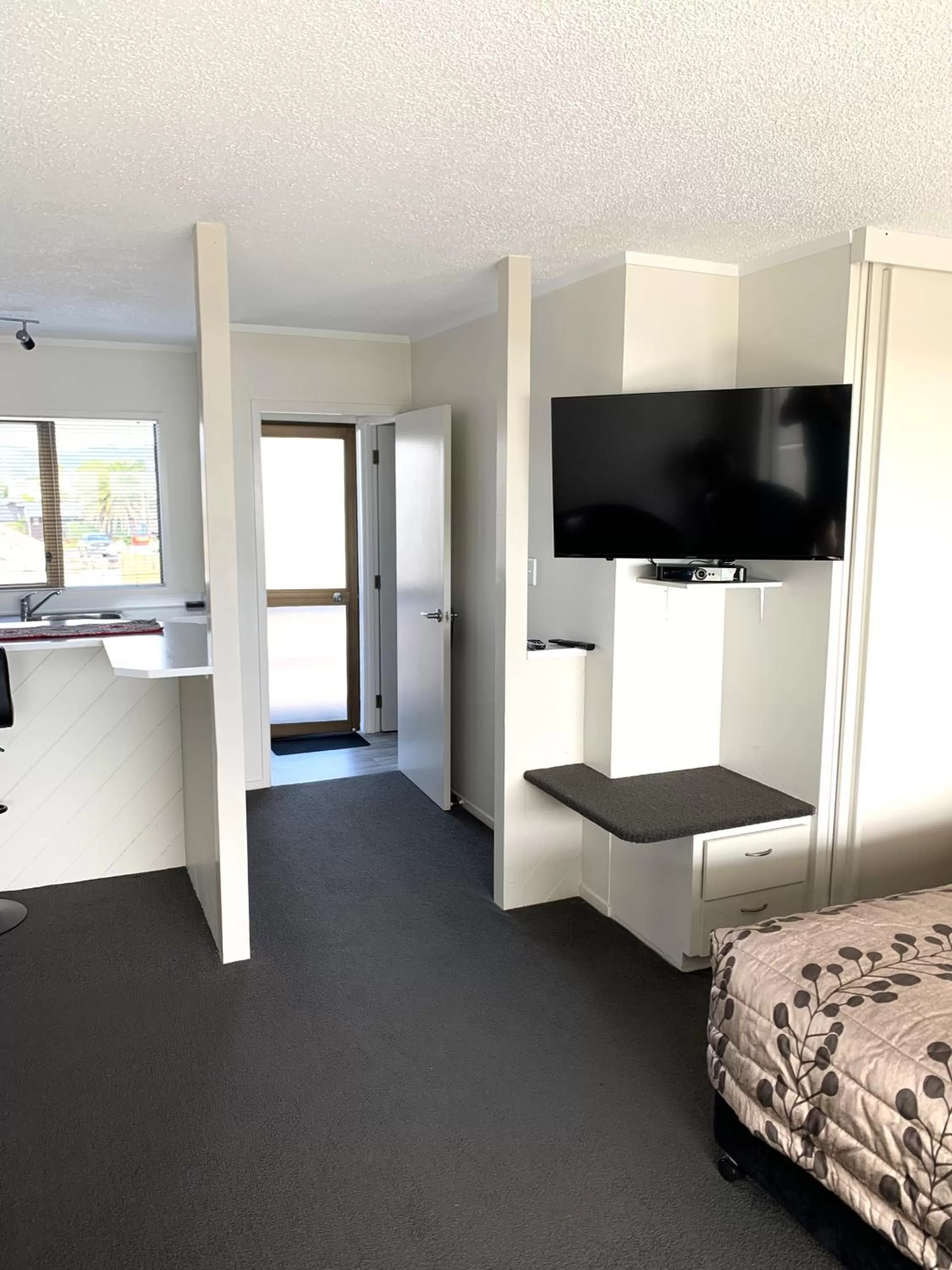 Bed in The Oceanside Motel