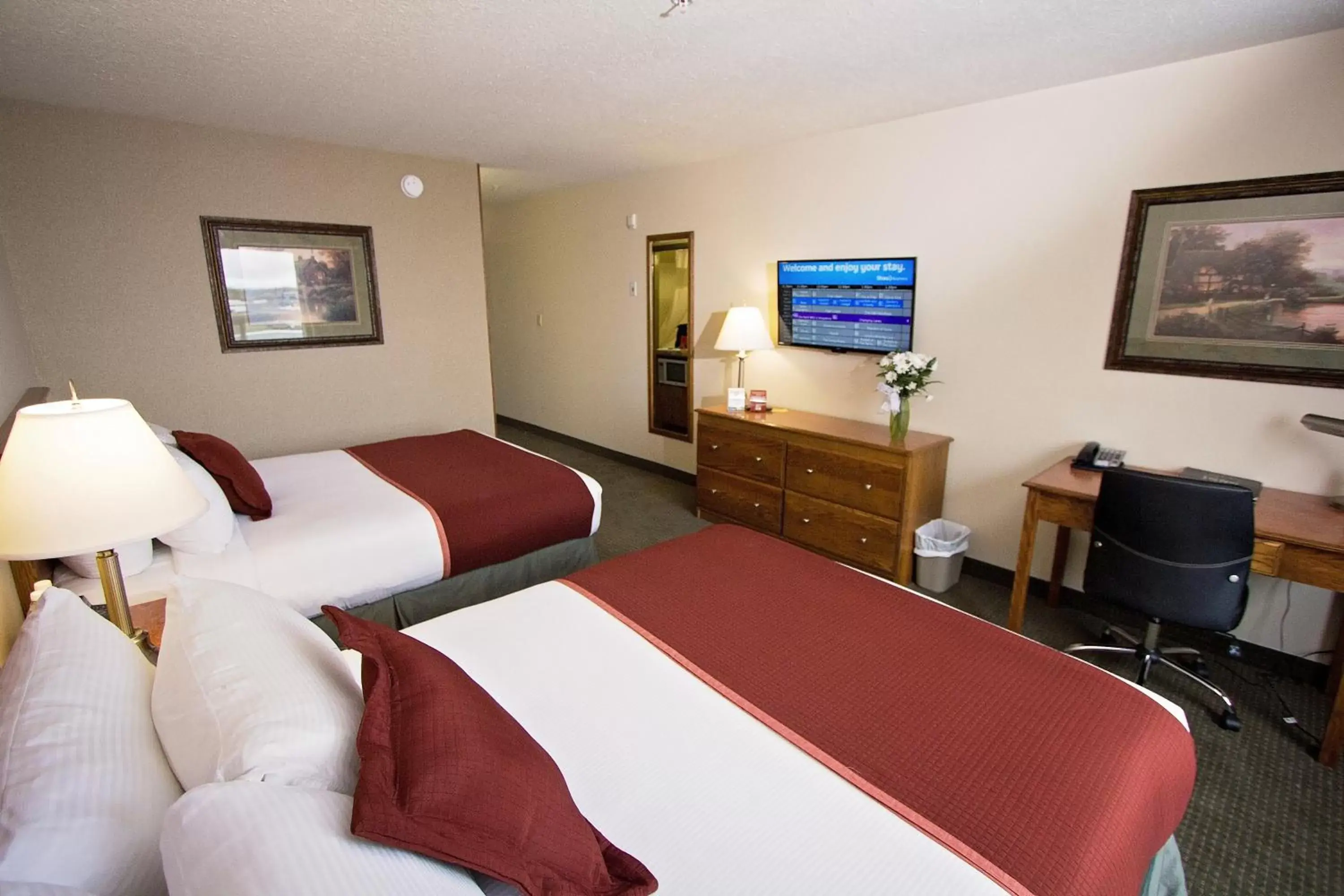 Bedroom, TV/Entertainment Center in Service Plus Inns & Suites Drayton Valley