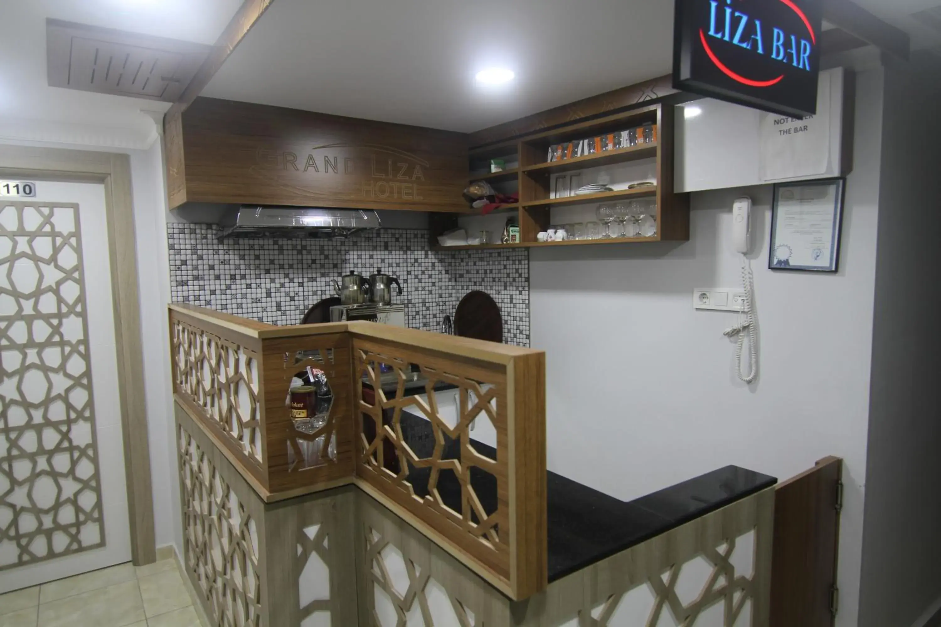 Lounge or bar, Kitchen/Kitchenette in Grand Liza Hotel