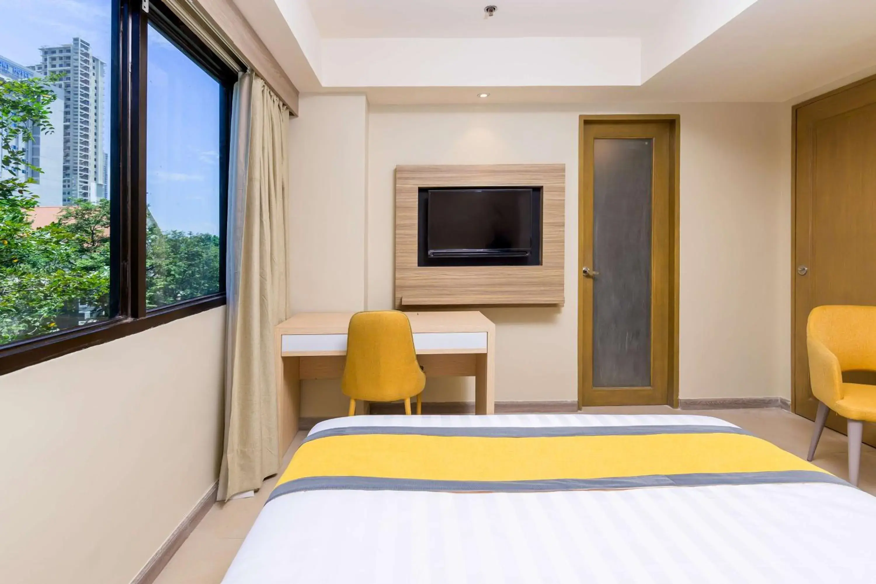 Bedroom, Bed in SureStay Plus by Best Western Cebu City