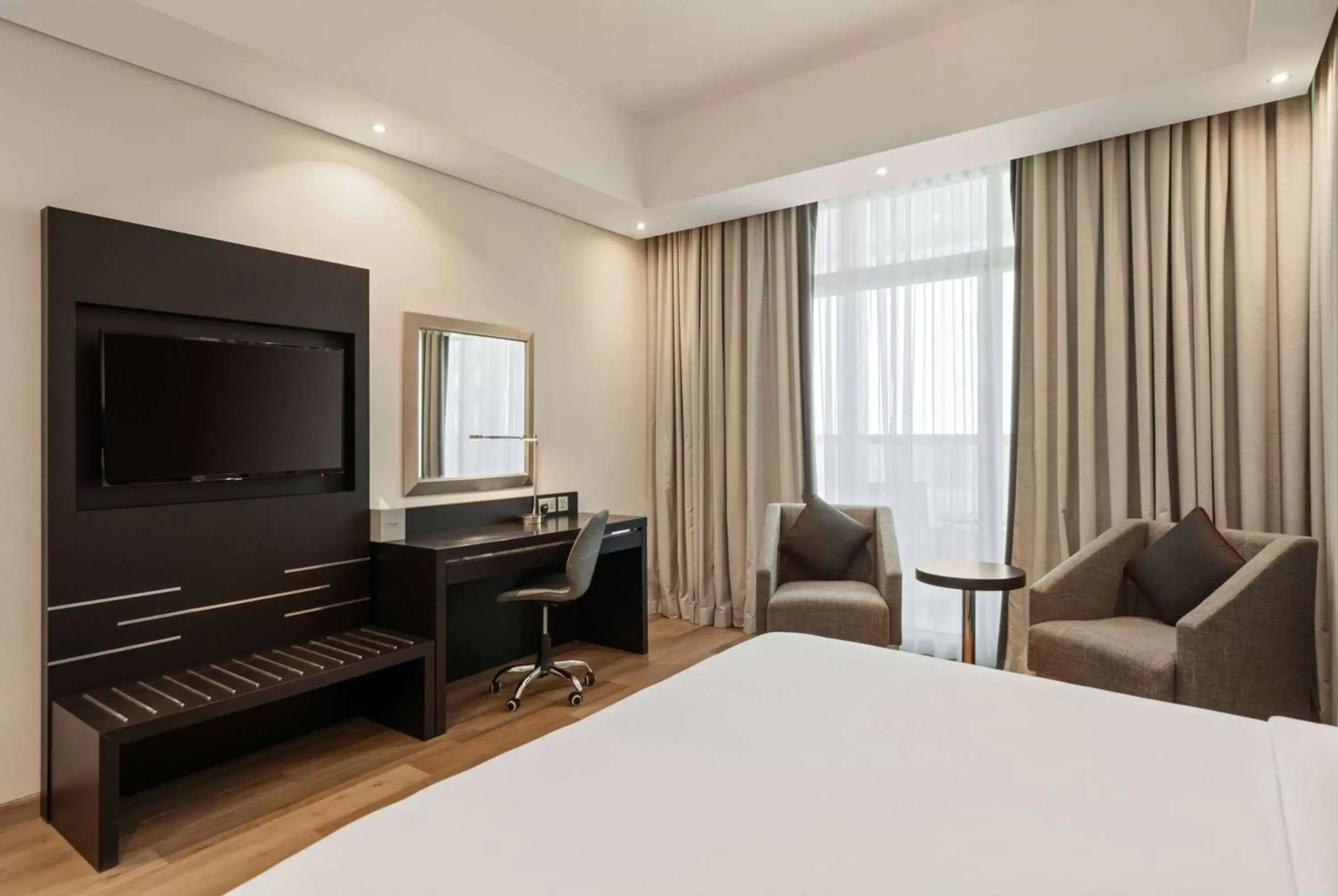 Photo of the whole room, TV/Entertainment Center in Ramada by Wyndham Dubai Barsha Heights