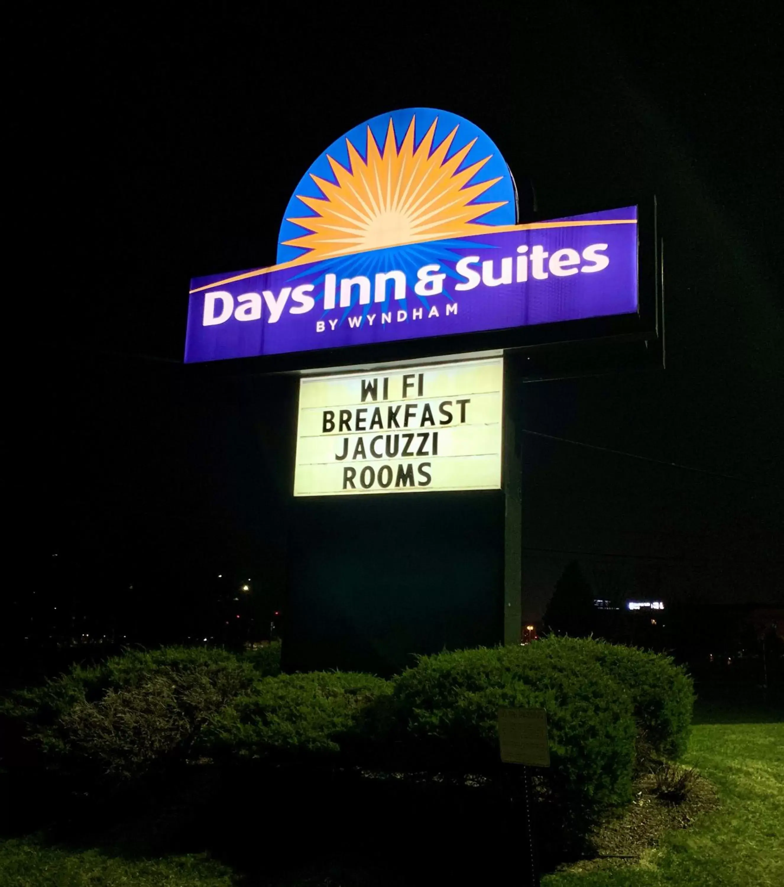 Property logo or sign in Days Inn & Suites by Wyndham Madison