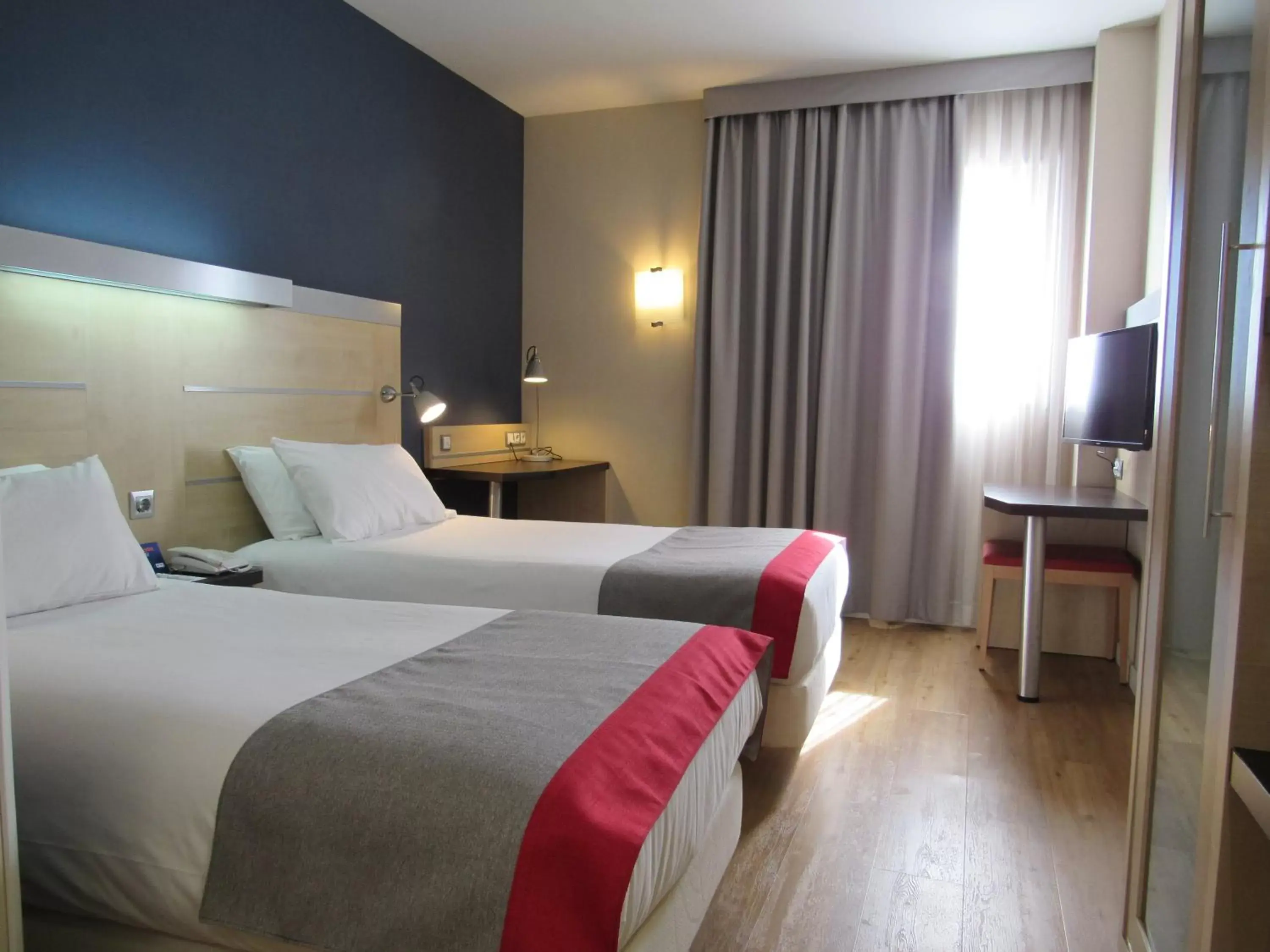 Bed in Holiday Inn Express Málaga Airport, an IHG Hotel