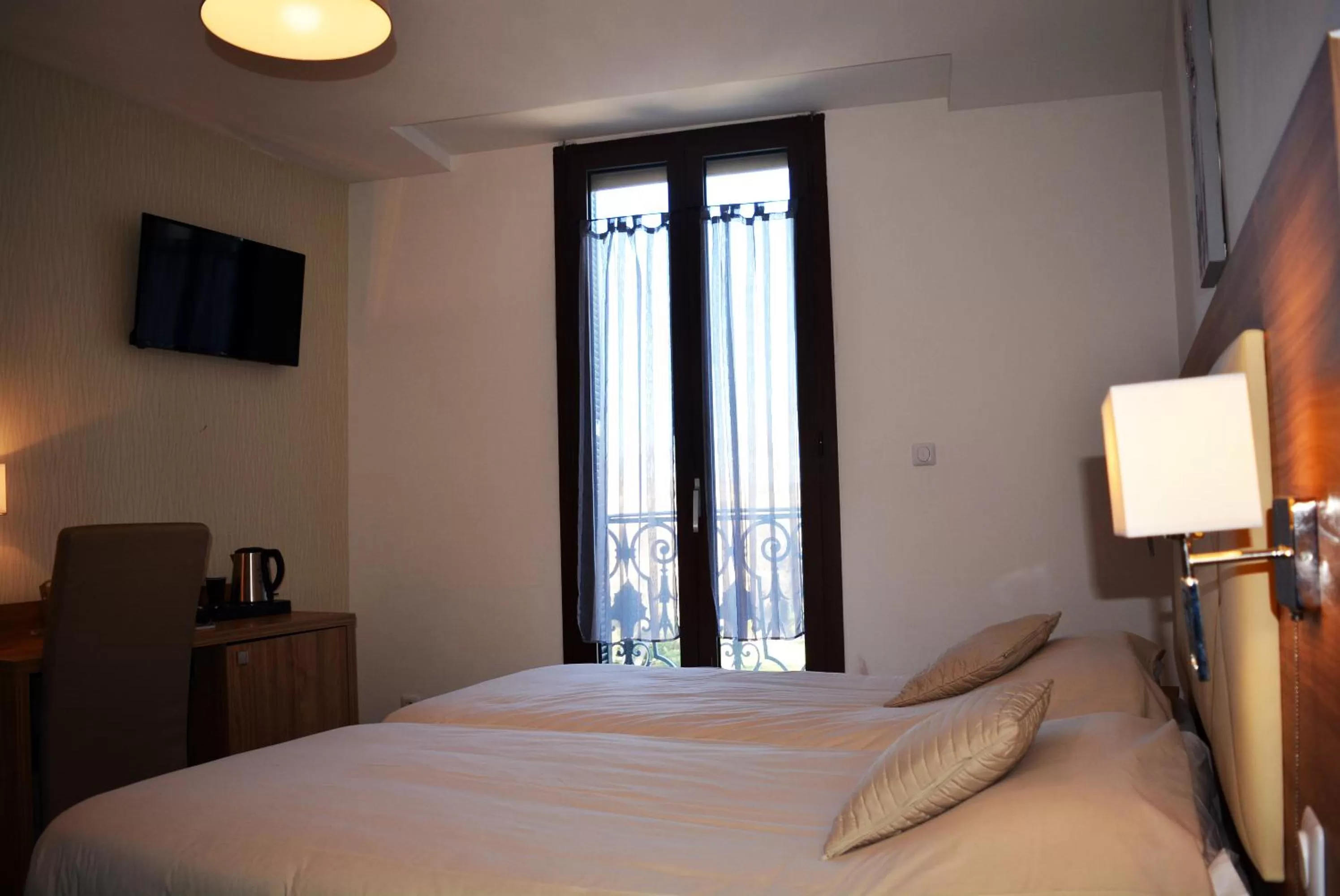 Bed in Le Grand Hôtel Molière