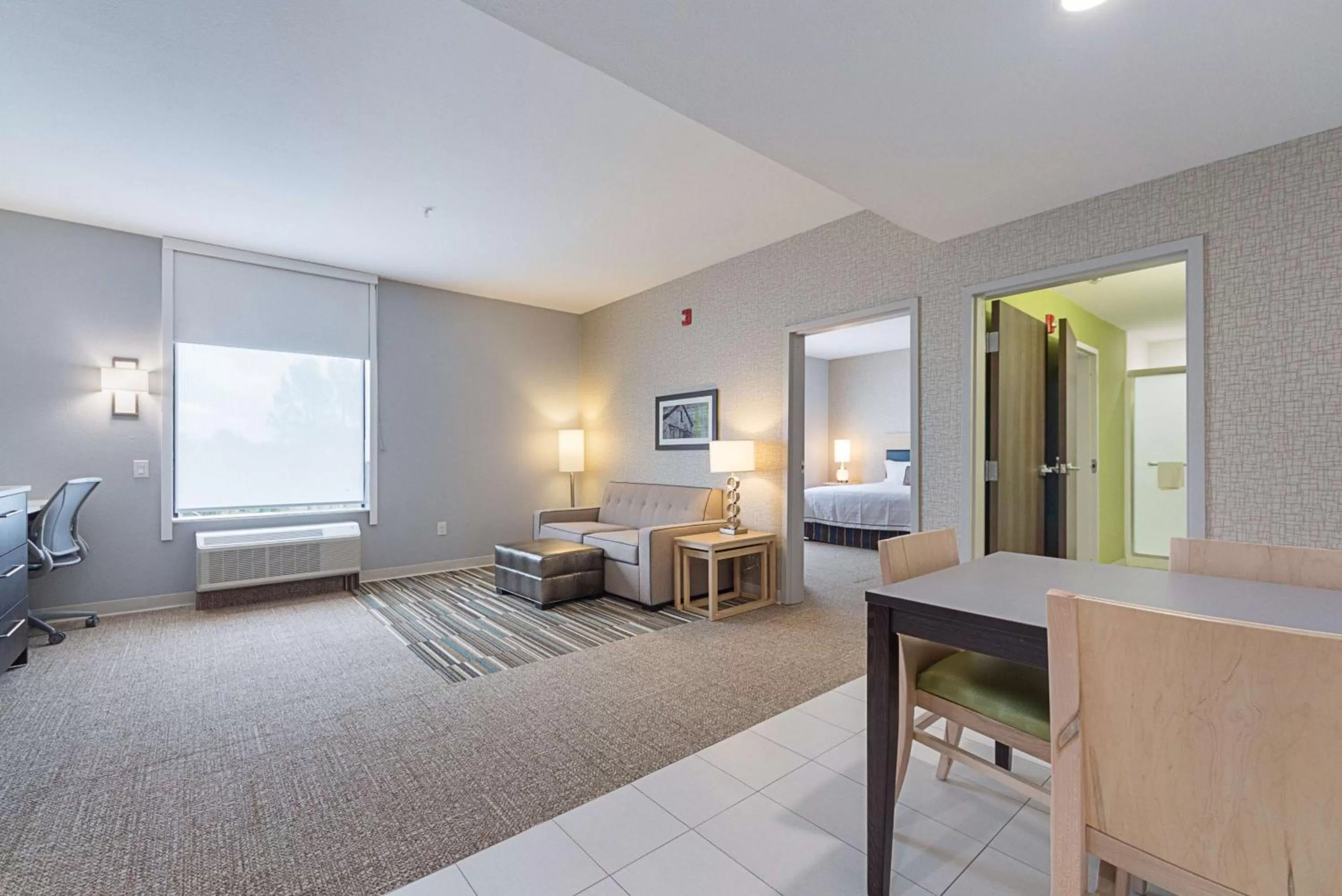Living room, Bed in Home2 Suites By Hilton Dallas Grand Prairie