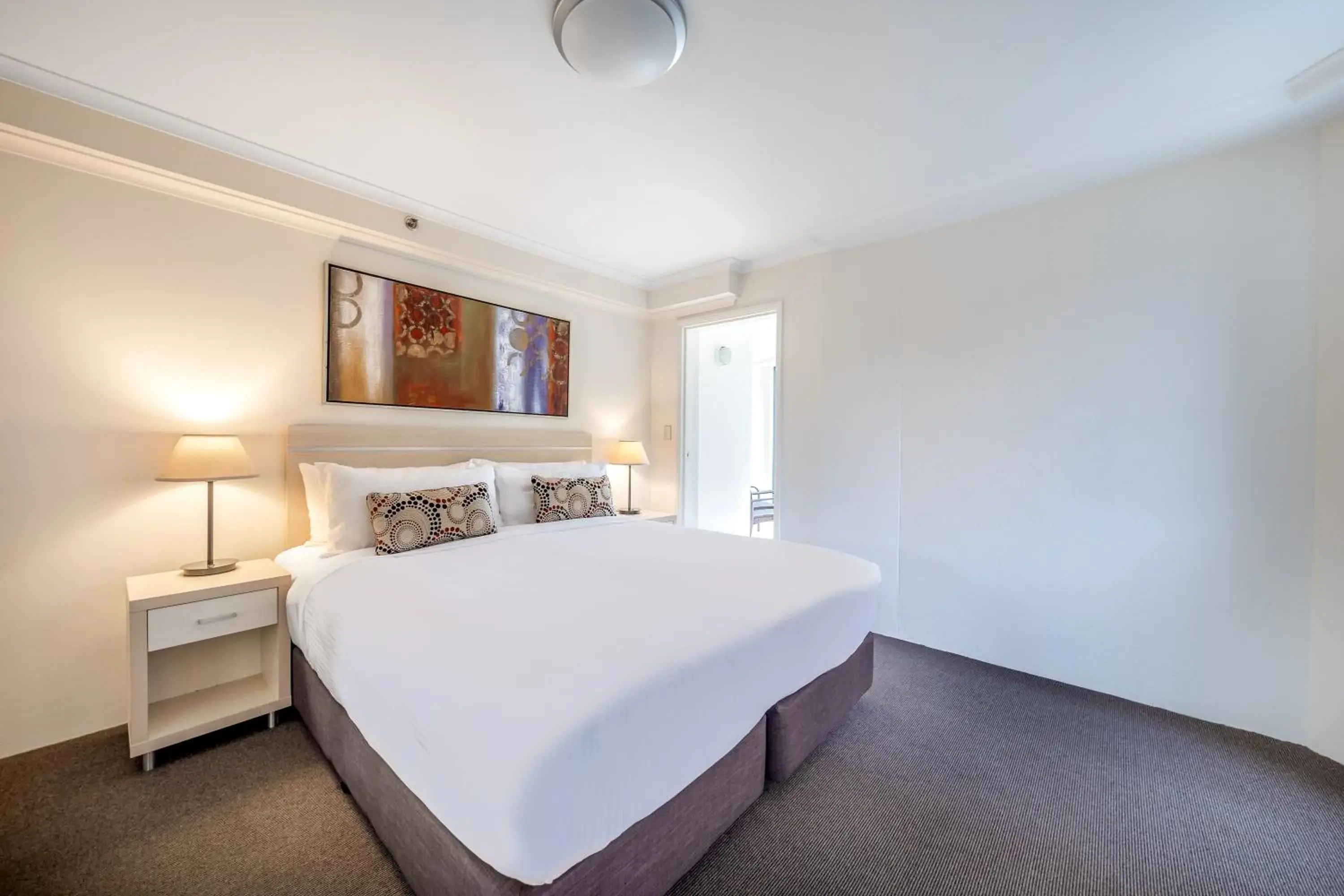 Bed in Oaks Sydney Castlereagh Suites