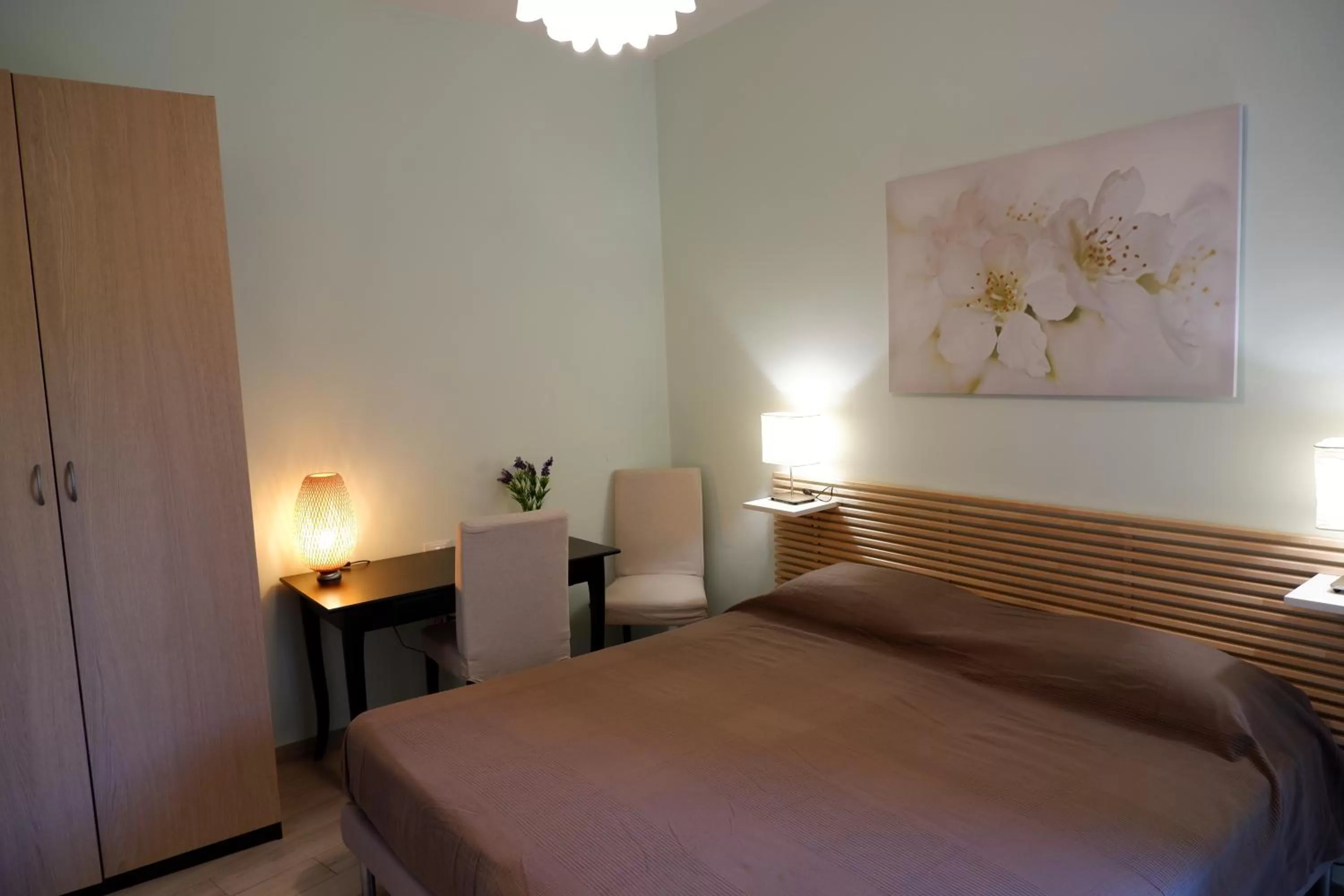 Photo of the whole room, Bed in B&B Il Giardino In Città - Parcheggio Privato Gratuito