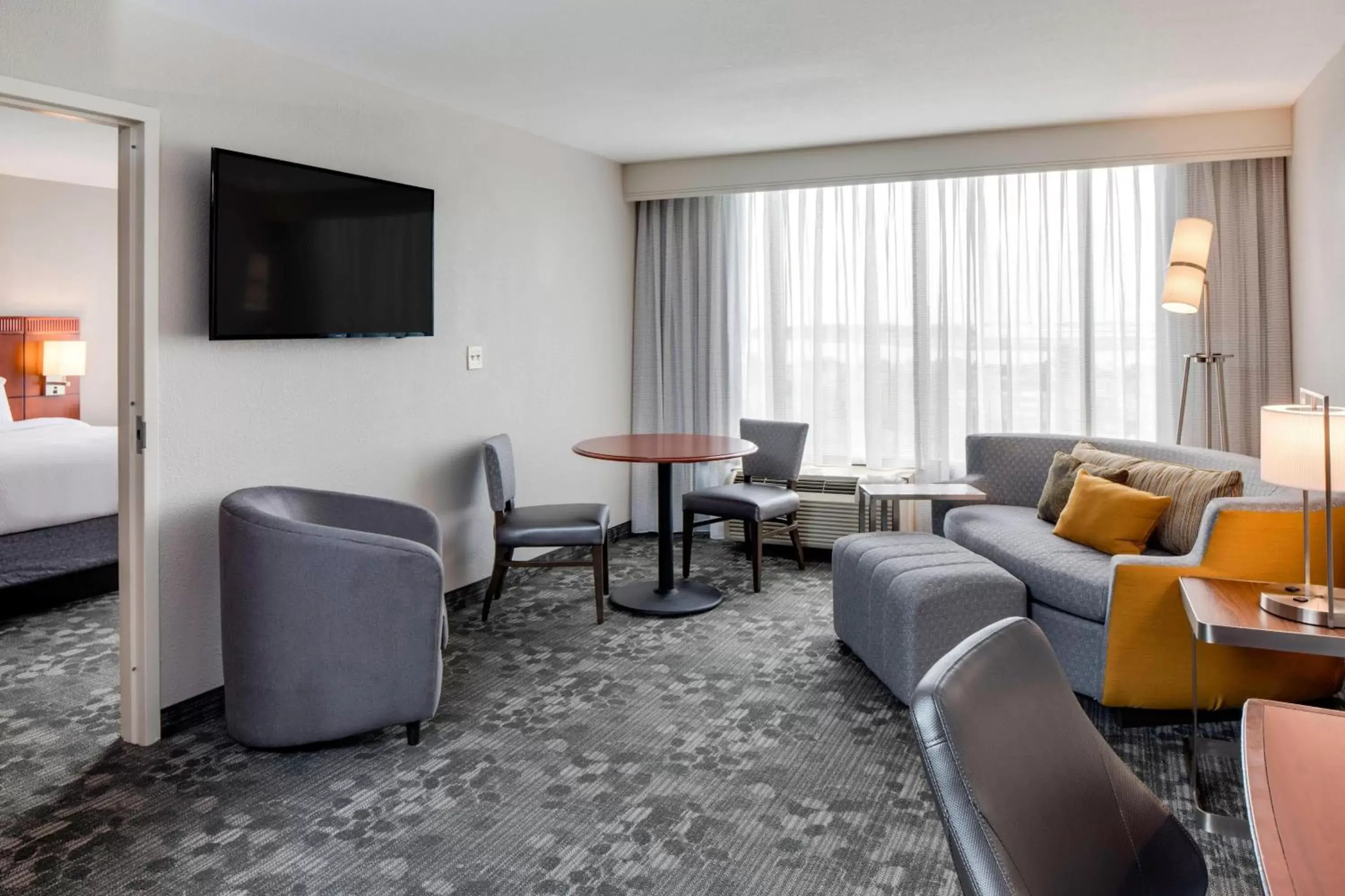 Photo of the whole room, Seating Area in Courtyard by Marriott Boston Logan Airport