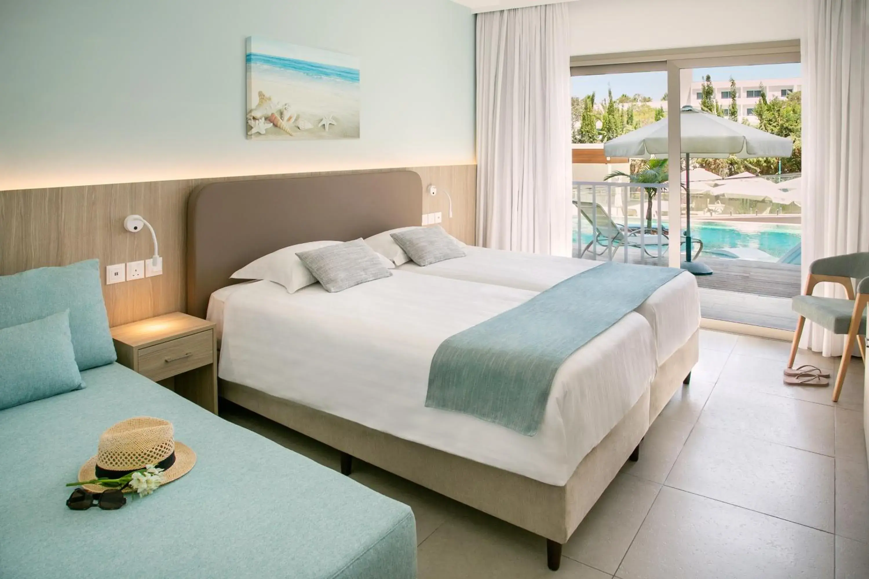 Bed in Asterias Beach Hotel