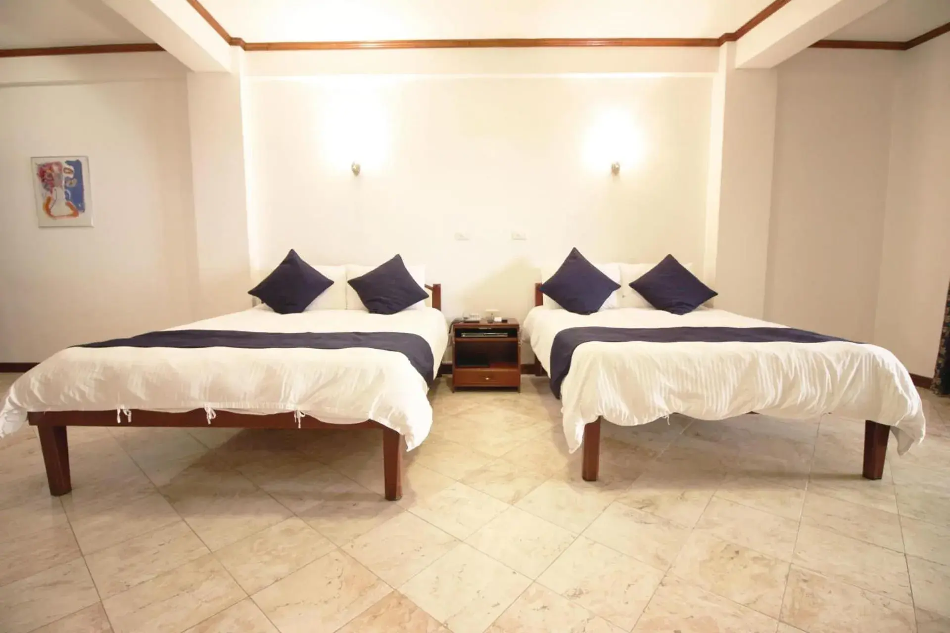 Bed in Mermaid Resort and Dive Center Bed in Mermaid Resort and Dive Center