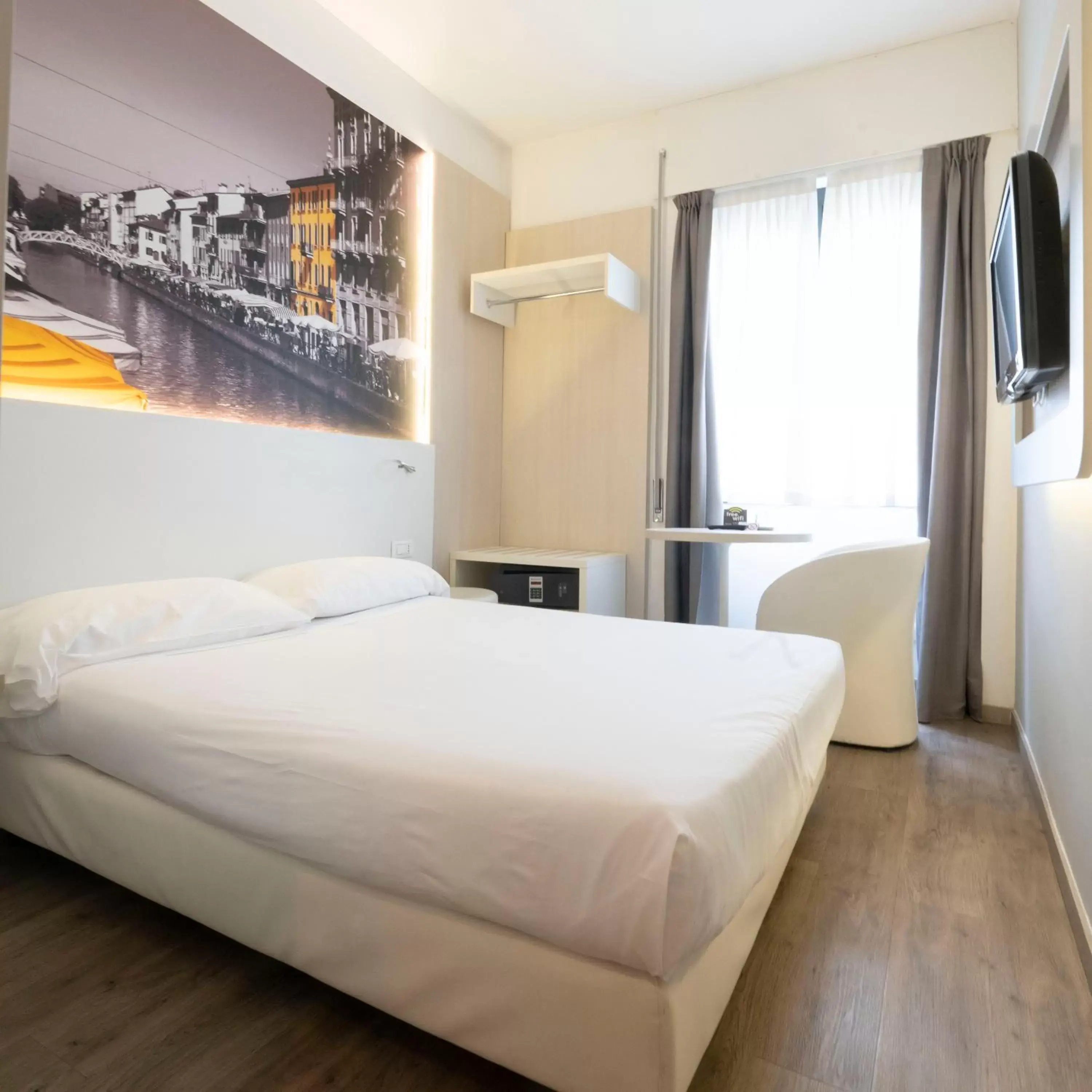 Bed in Kleos Hotel Milano