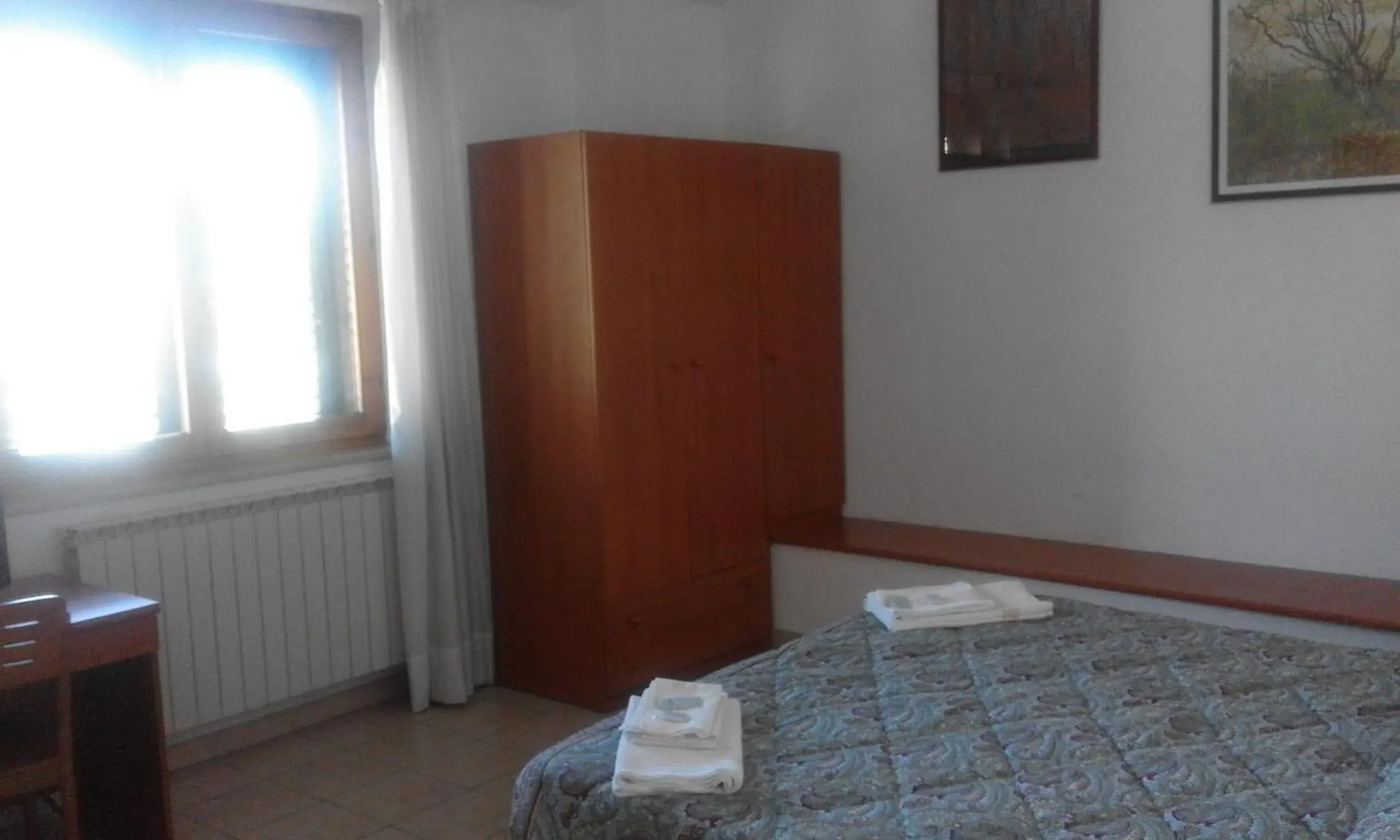 Photo of the whole room, Bed in Osteria dei Locandieri