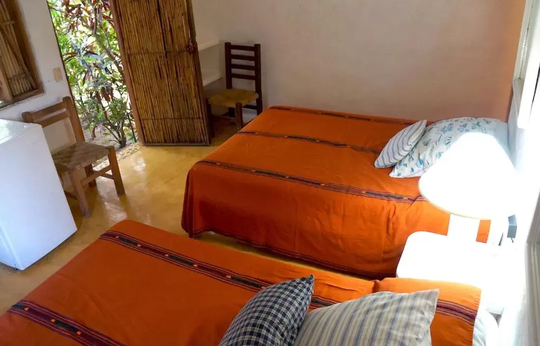 Bed in Junto al Rio Bungalows & Suites