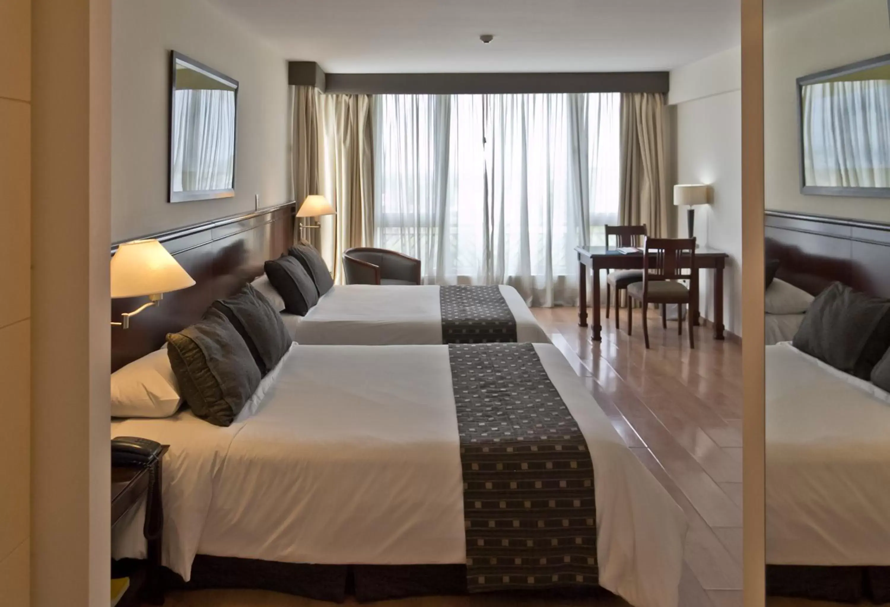 Bed in Amerian Executive Hotel Mendoza