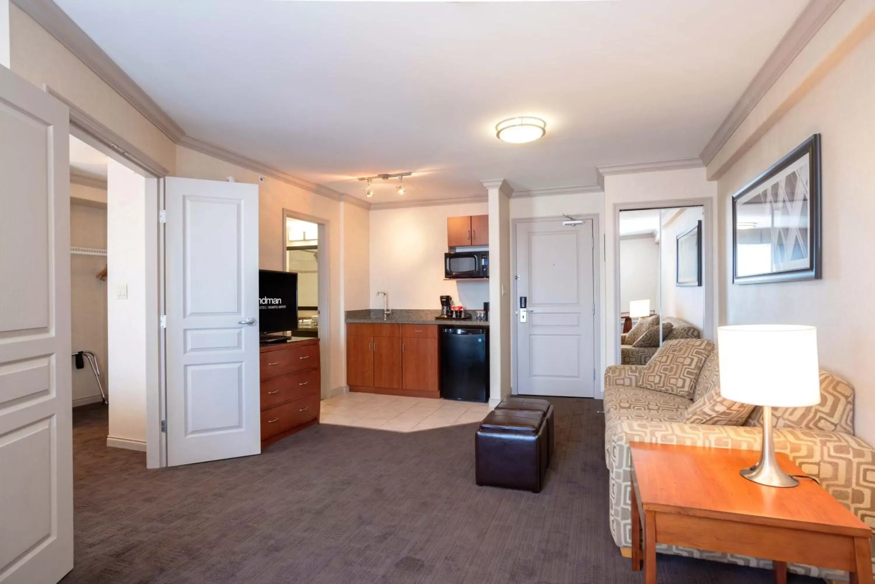 Photo of the whole room, Kitchen/Kitchenette in Sandman Hotel & Suites Winnipeg Airport