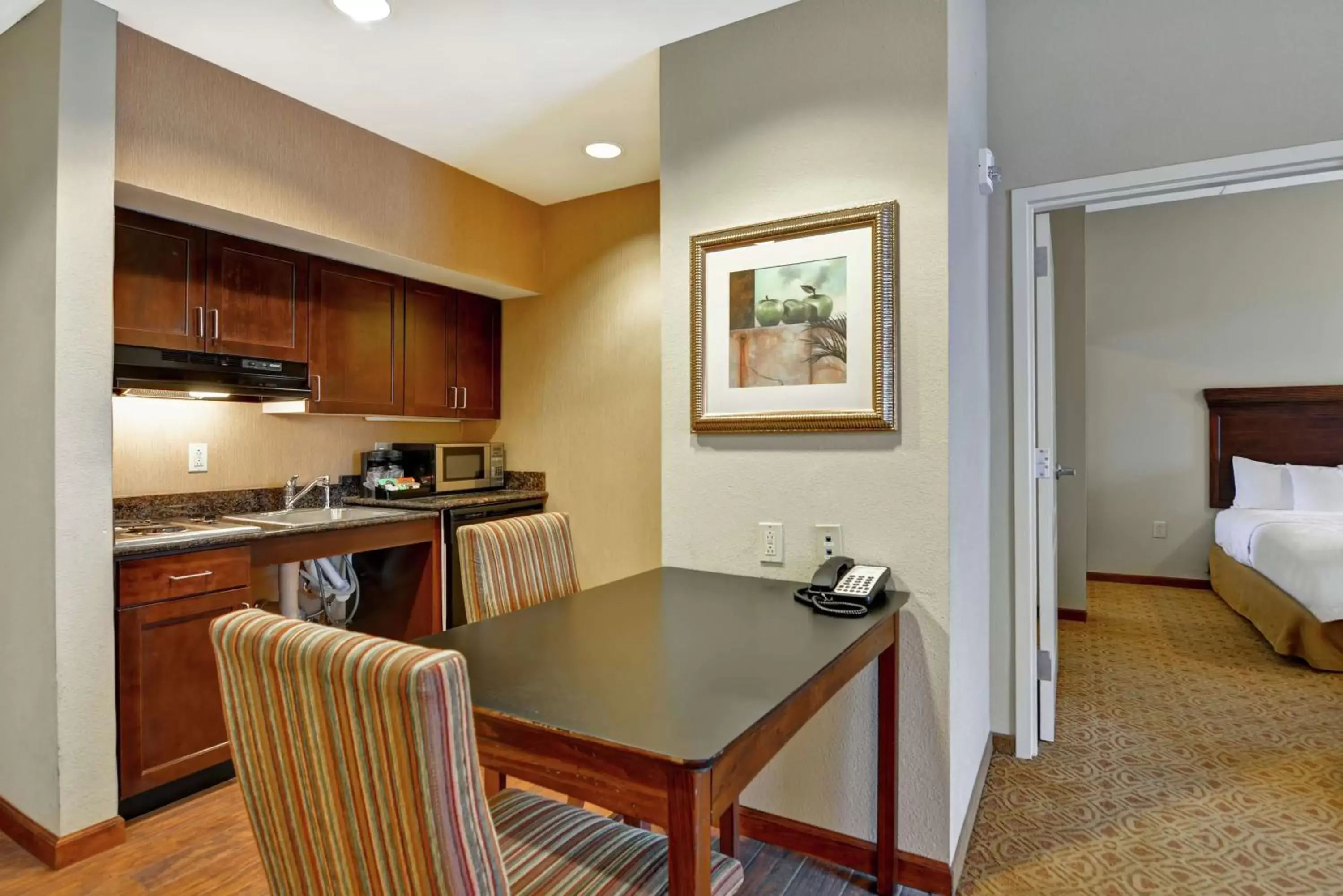 Bedroom, Kitchen/Kitchenette in Homewood Suites Fredericksburg