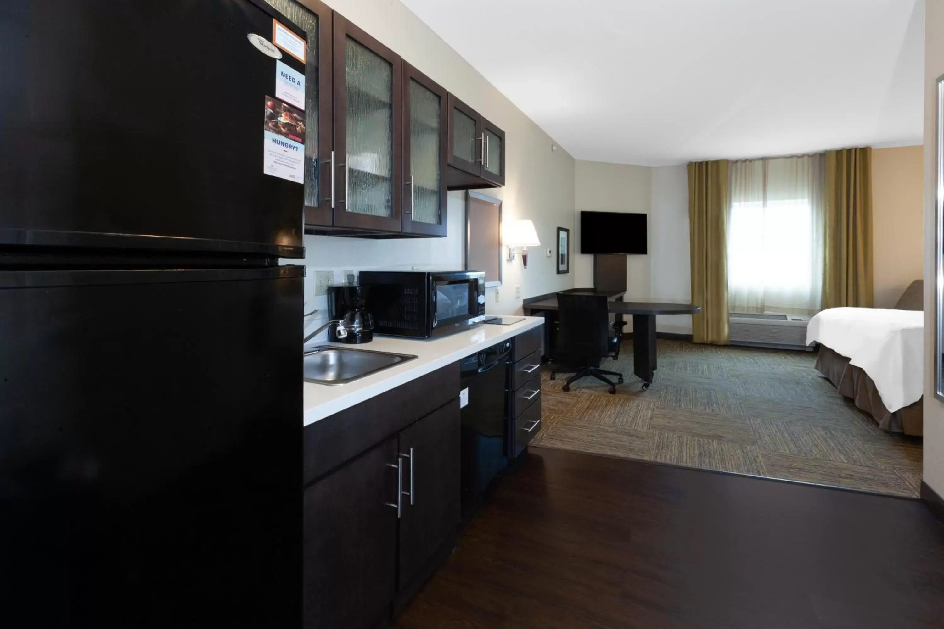 Kitchen or kitchenette, Kitchen/Kitchenette in Candlewood Suites Kalamazoo, an IHG Hotel