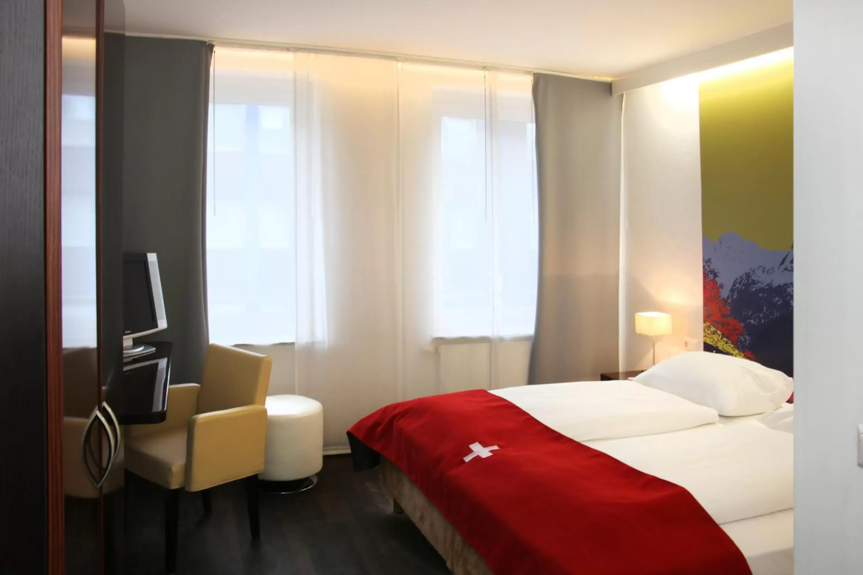 Bedroom, Bed in Helvetia Hotel Munich City Center