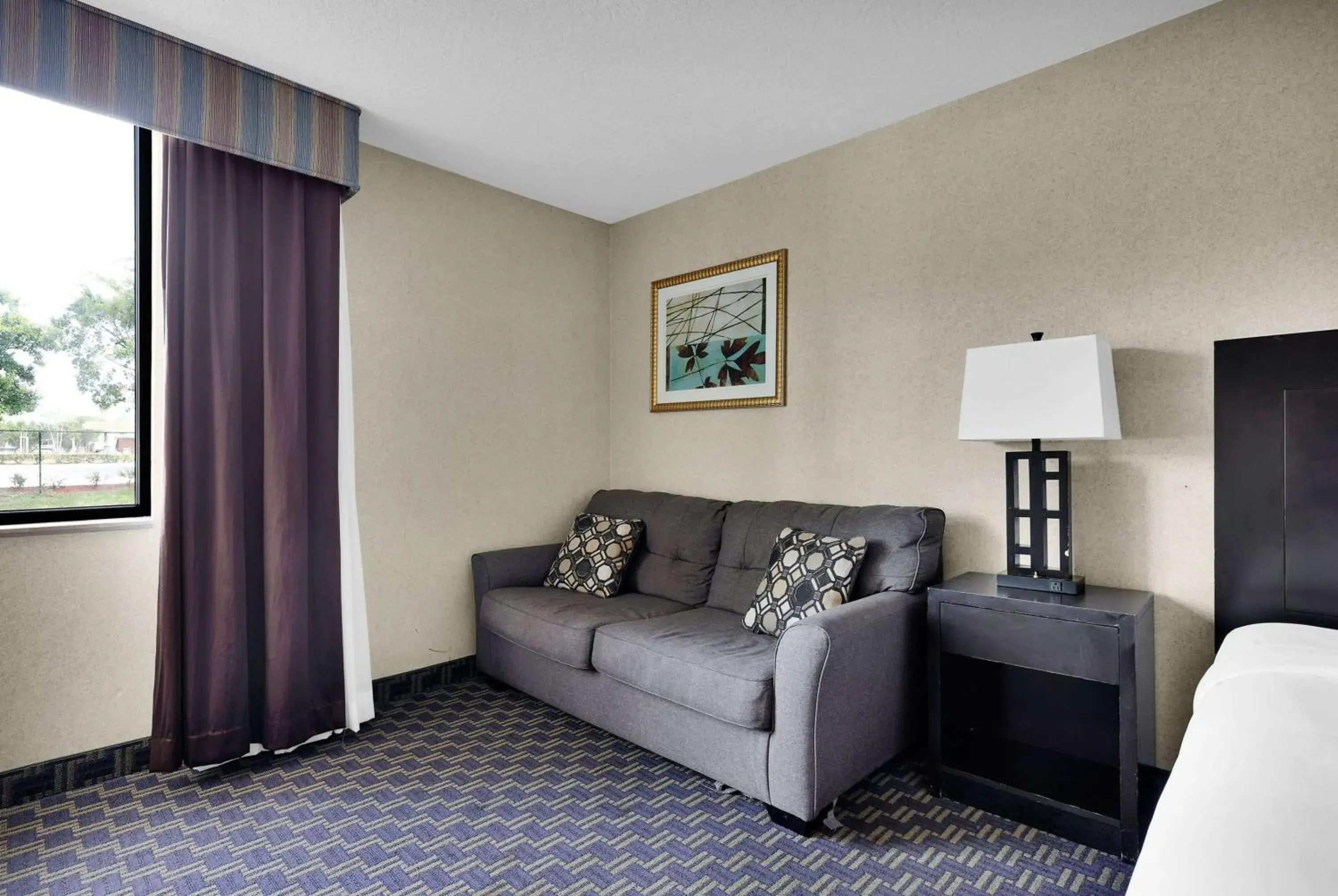 Photo of the whole room, Seating Area in Ramada by Wyndham Jacksonville I-95 by Butler Blvd