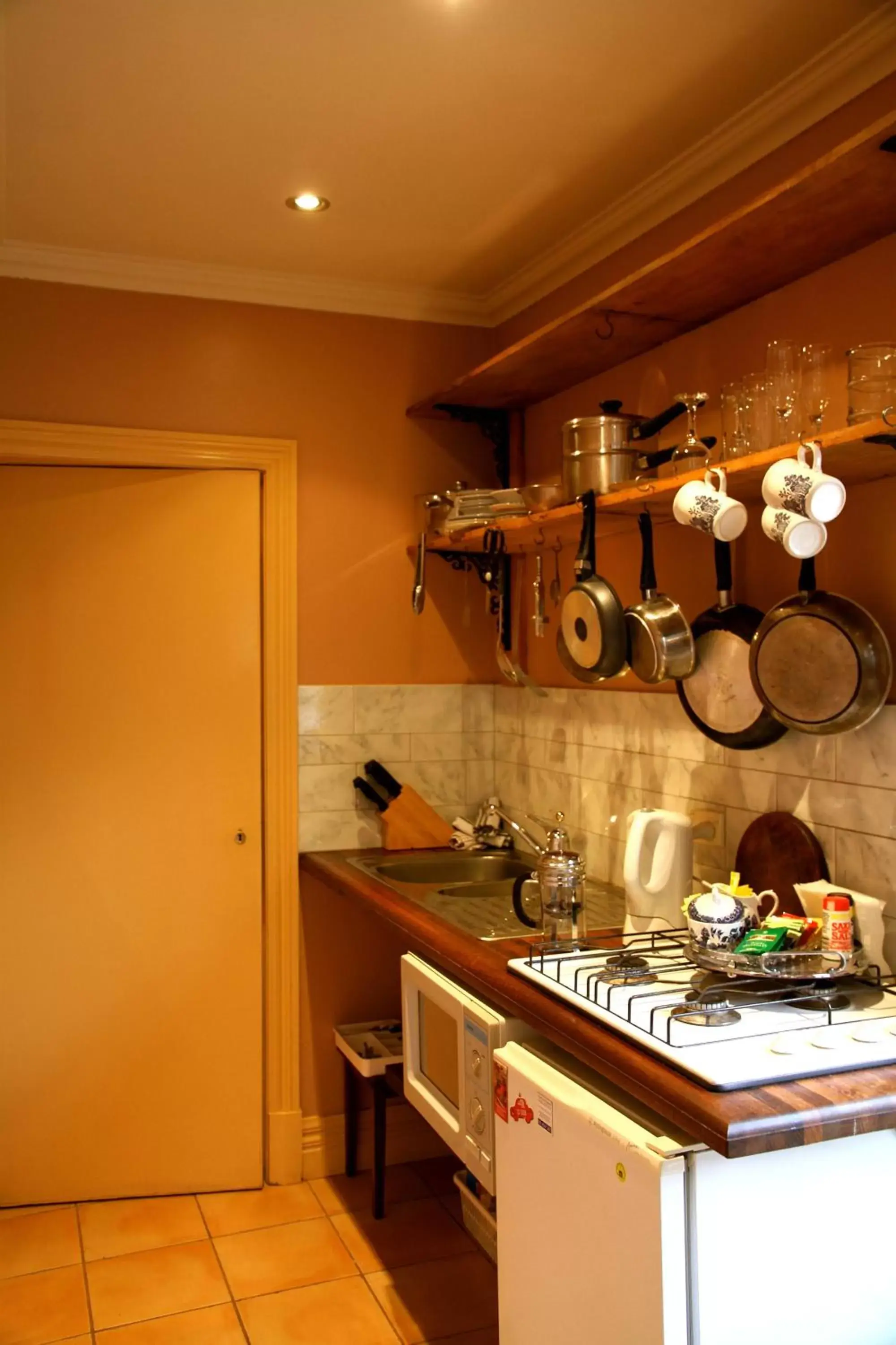 Kitchen or kitchenette in North Adelaide Heritage Cottages & Apartments