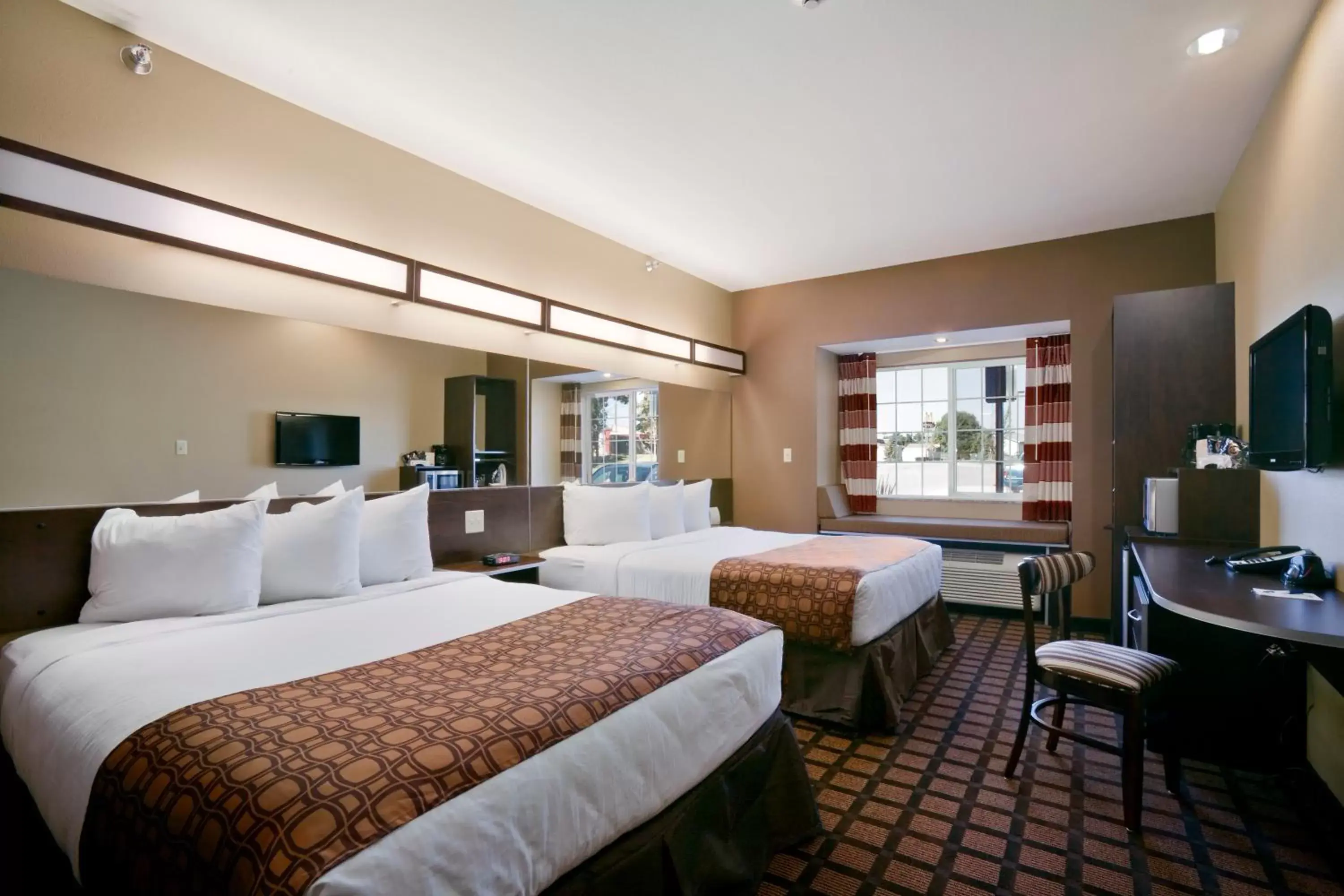 Photo of the whole room, Bed in Microtel Inn & Suites Photo of the whole room, Bed in Microtel Inn & Suites