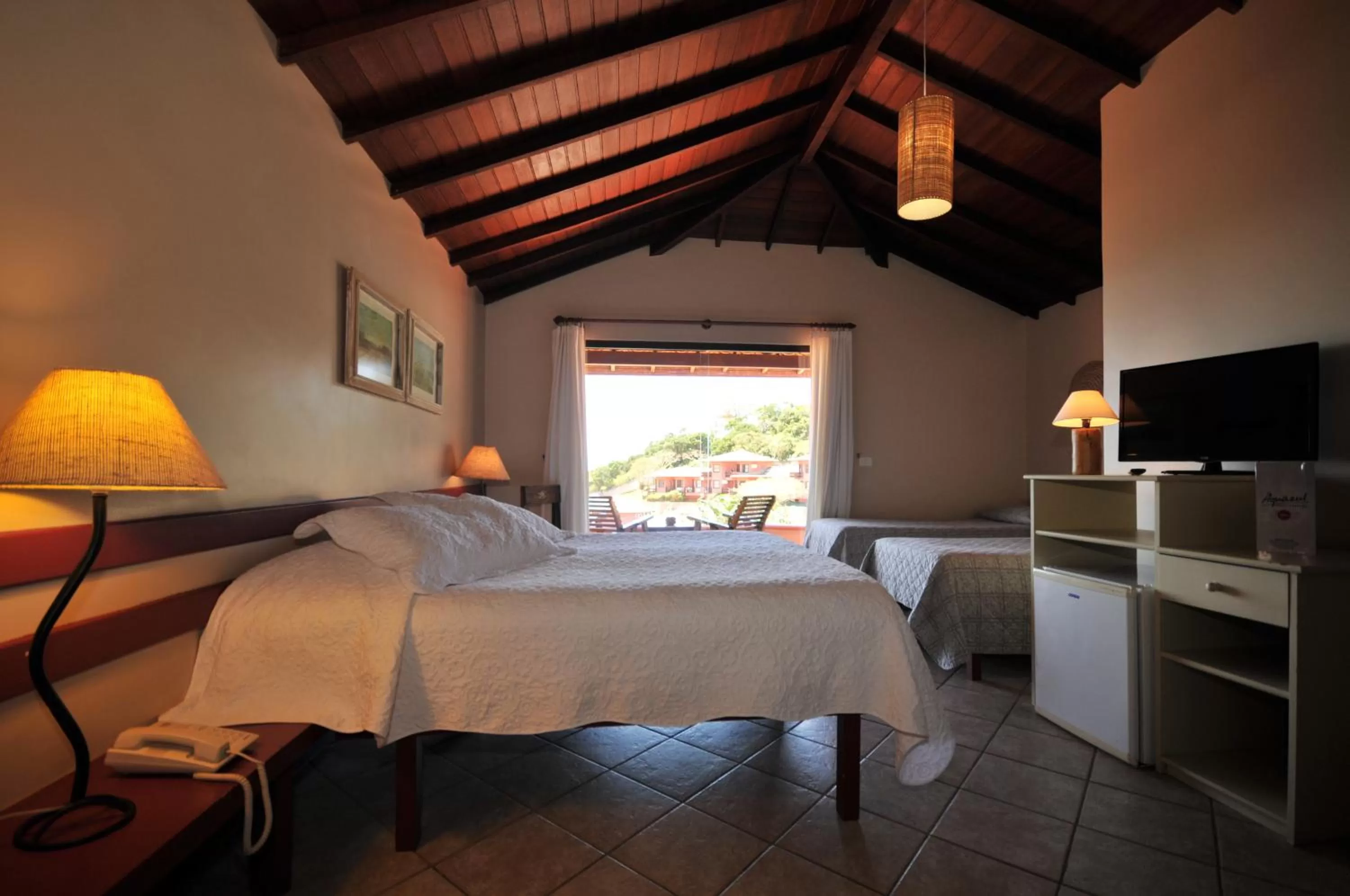 Bed in Aguabúzios Hotel