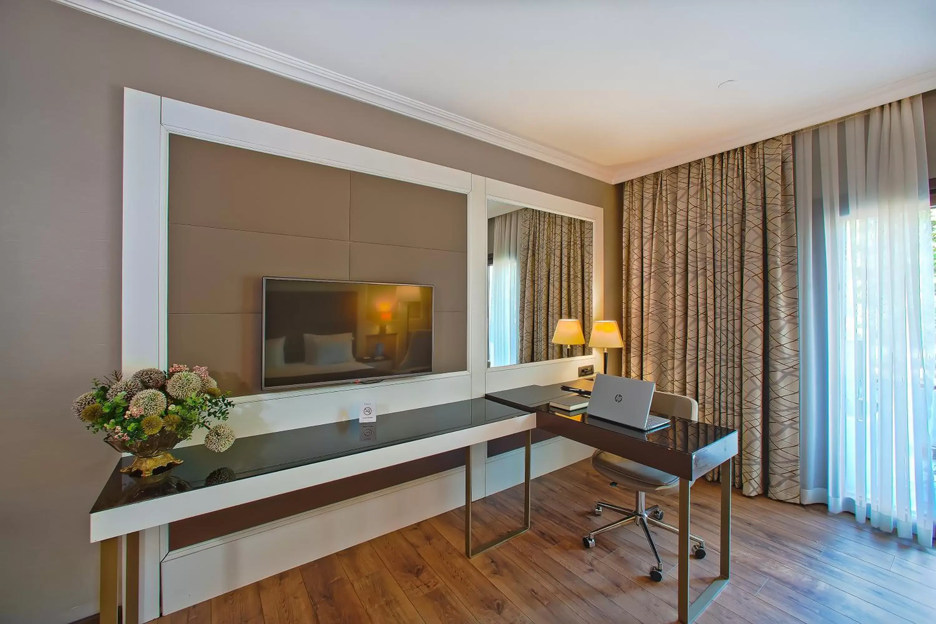 Bed, TV/Entertainment Center in Ramada Hotel & Suites by Wyndham Istanbul Merter