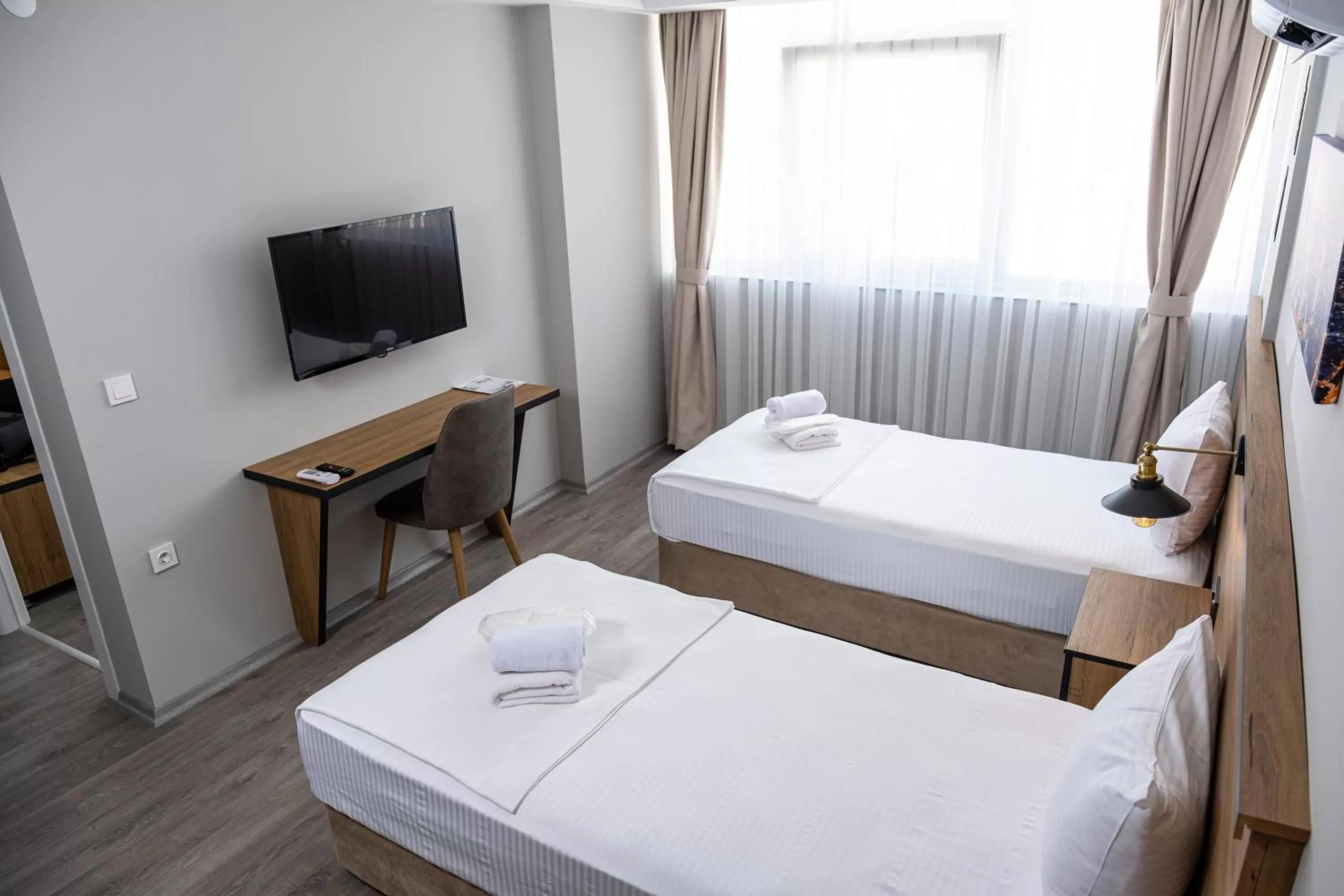 Bed in Comfort Center Suit Hotel