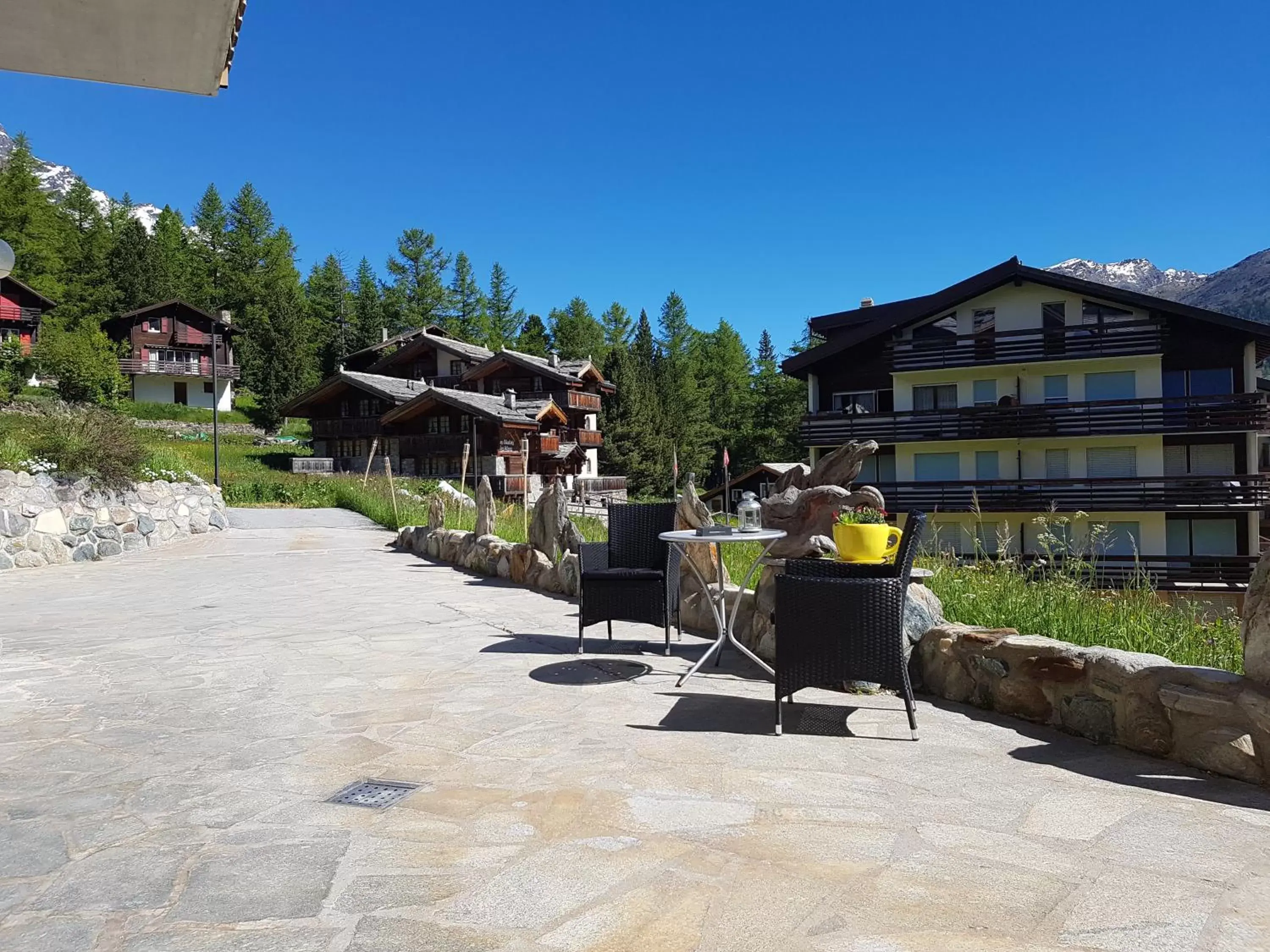 Garden view, Property Building in Hotel Alpenperle