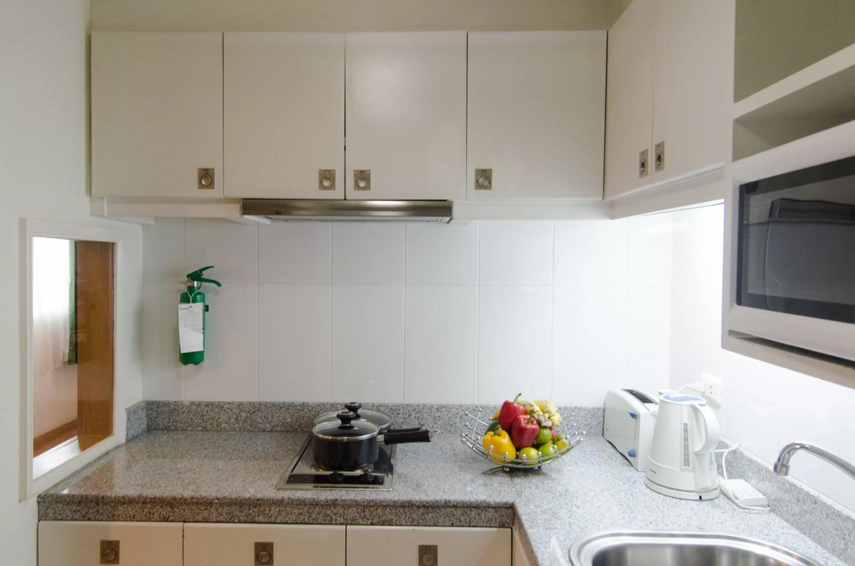 Kitchen or kitchenette in AT EASE saladaeng by AETAS