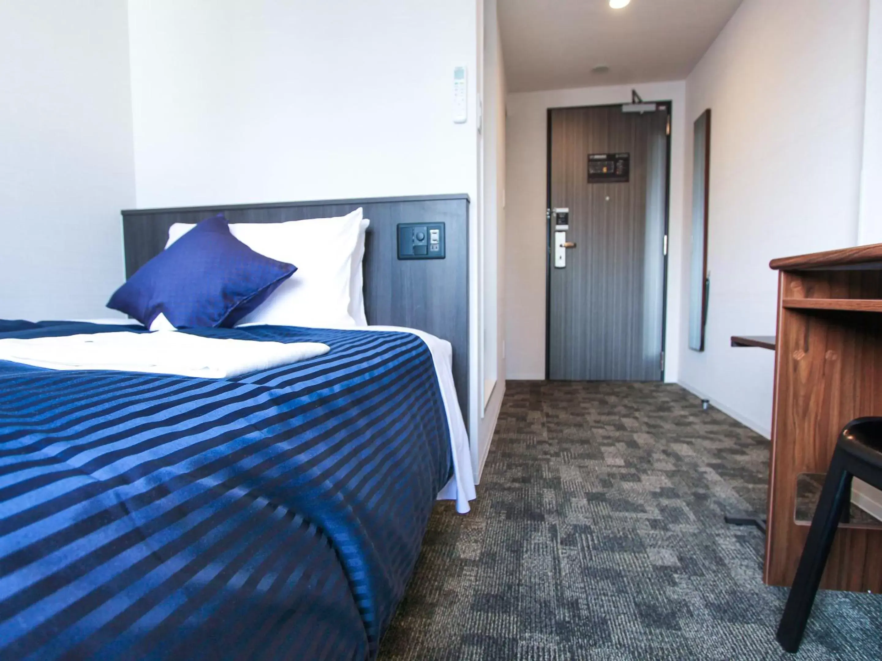 Bed in HOTEL LiVEMAX Osaka Yodoyabashi Bed in HOTEL LiVEMAX Osaka Yodoyabashi