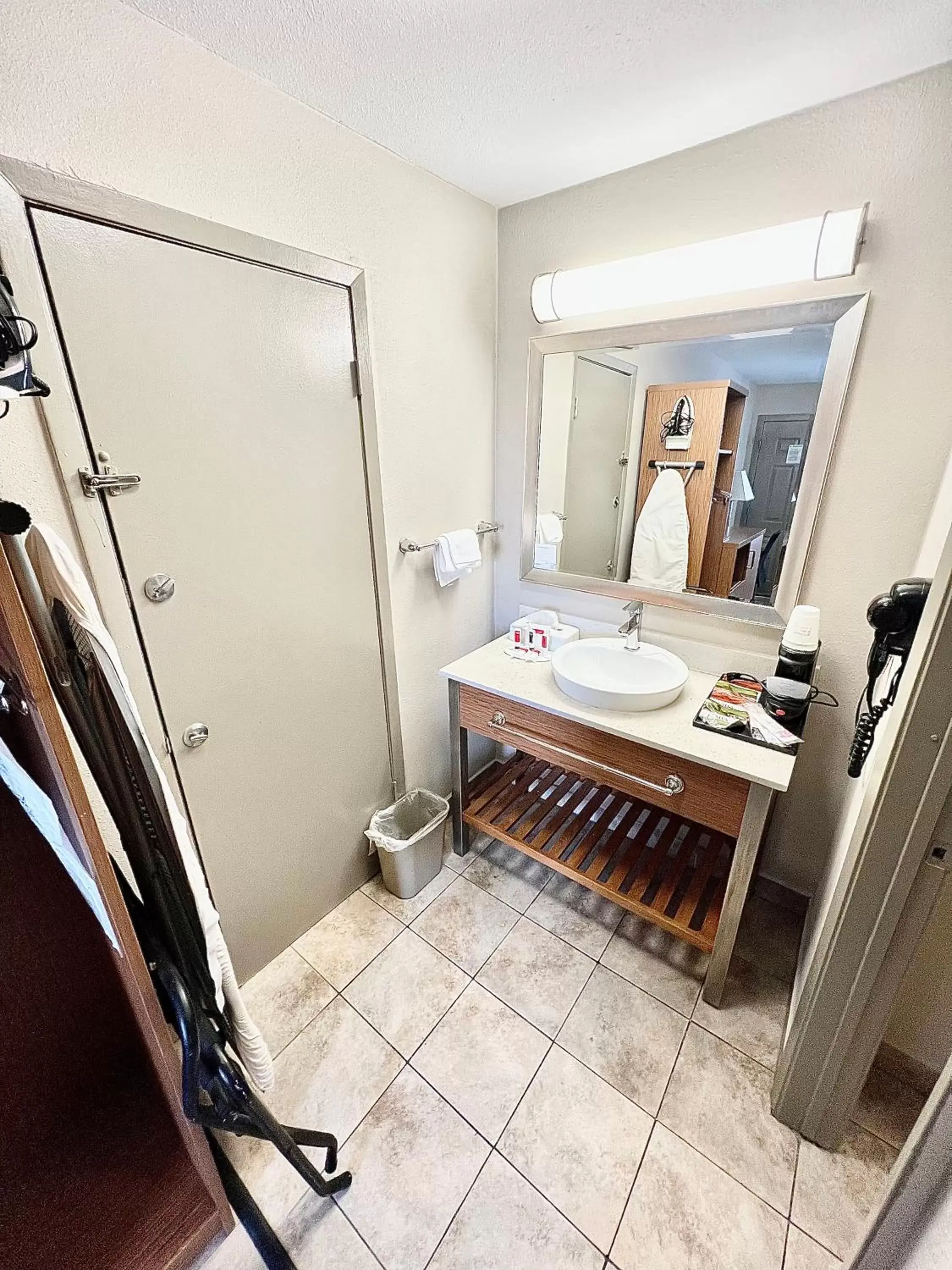 Bathroom in Days Inn & Suites by Wyndham Arlington Near Six Flags