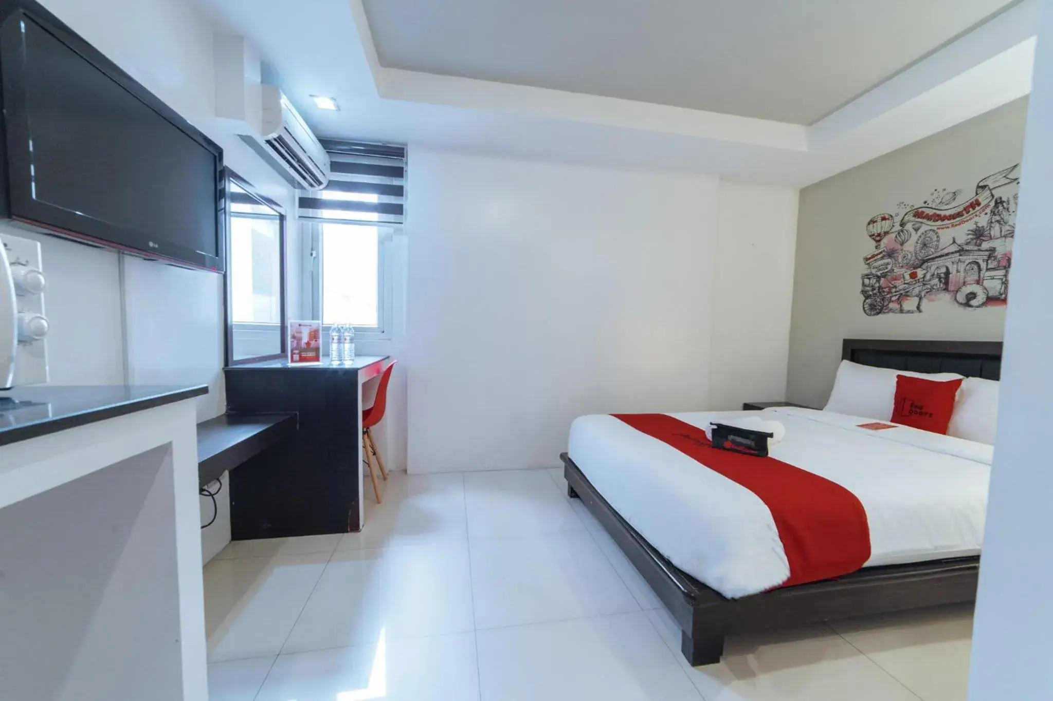 Bedroom, Bed in RedDoorz Plus at One Liberty Hotel Kalayaan Avenue