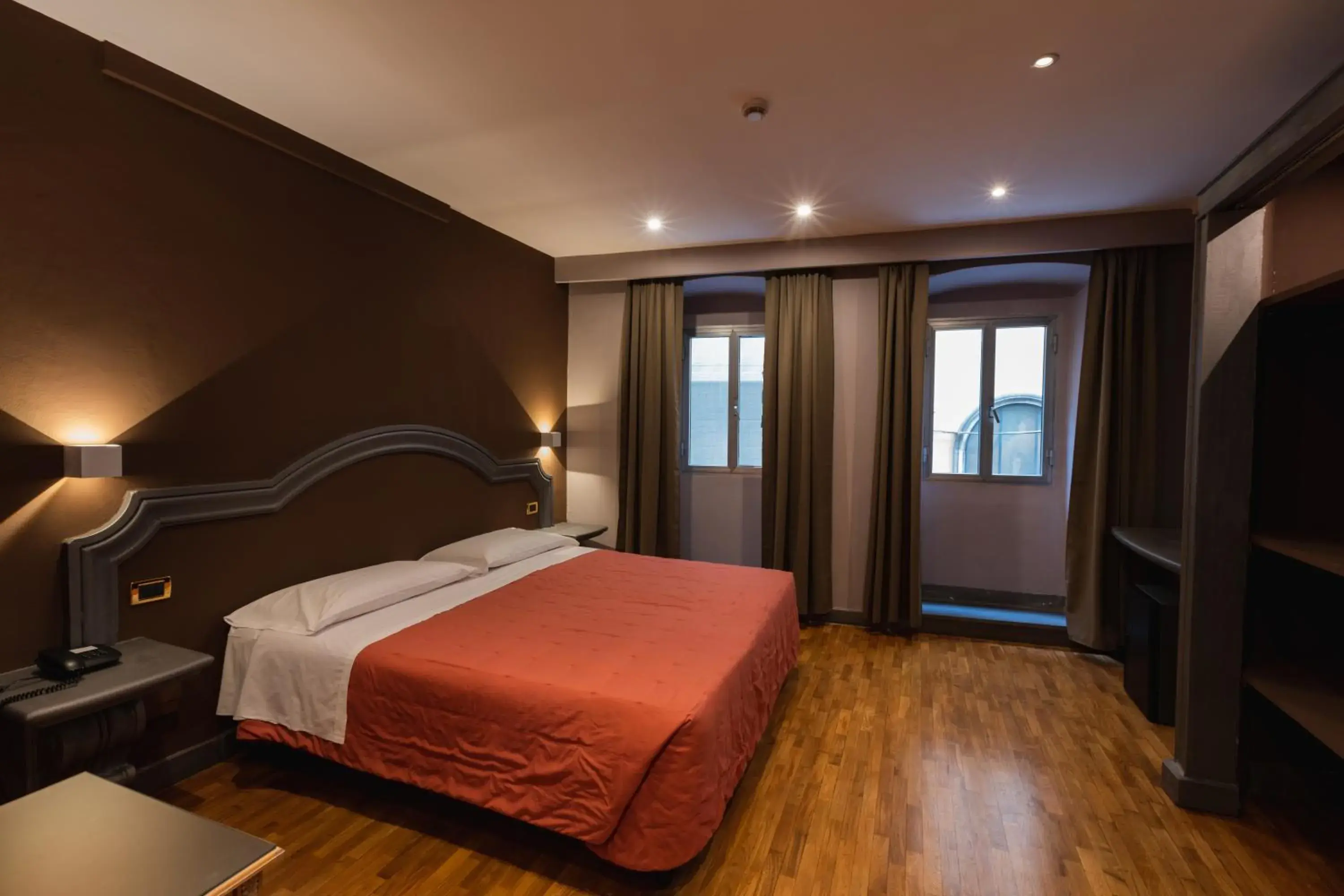 Bed in Hotel Unicorno