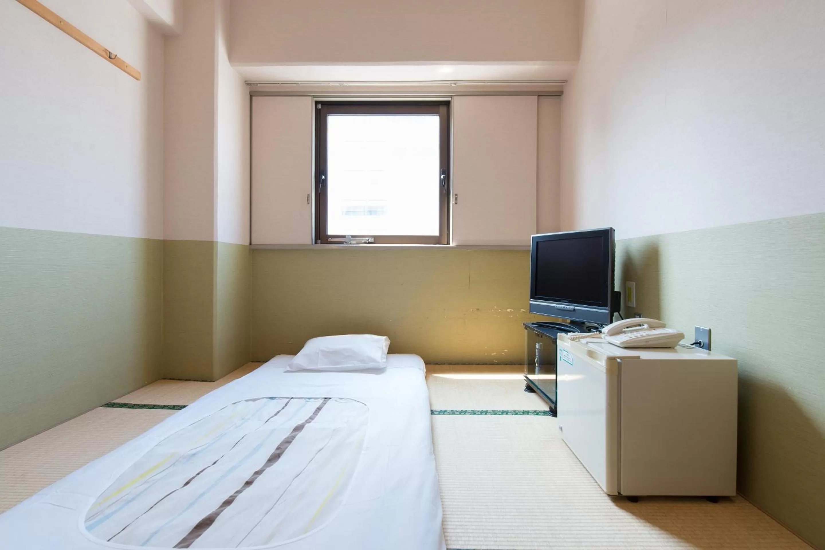 Photo of the whole room, Bed in Tabist Hotel Tetora Kitakyushu
