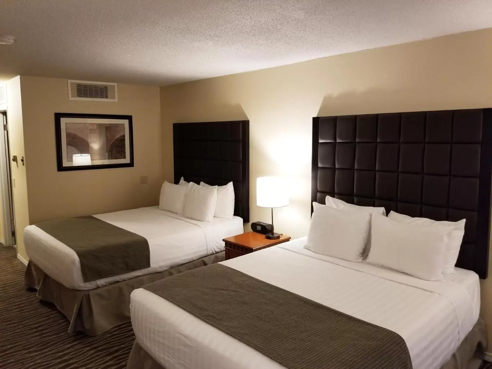 Queen Room with Two Queen Beds and Courtyard View in Prestige Vernon Lodge