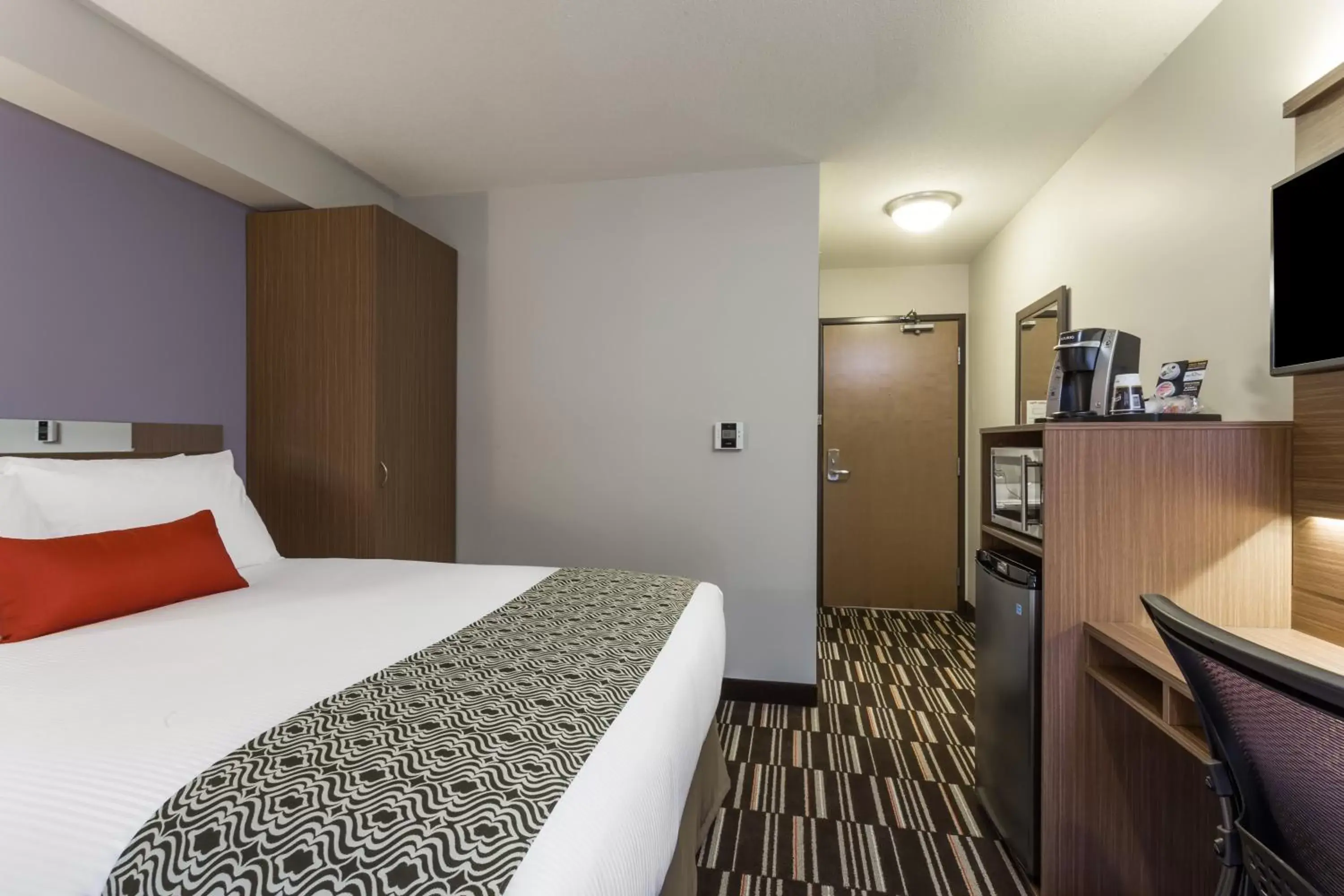 Bed in Microtel Inn & Suites by Wyndham Fort Saint John