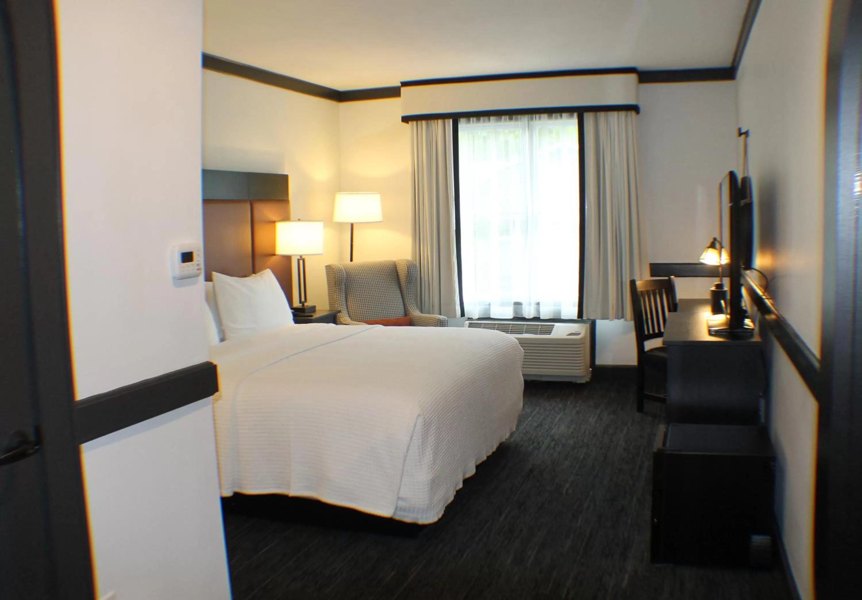 Bed in The Craftsman Inn & Suites