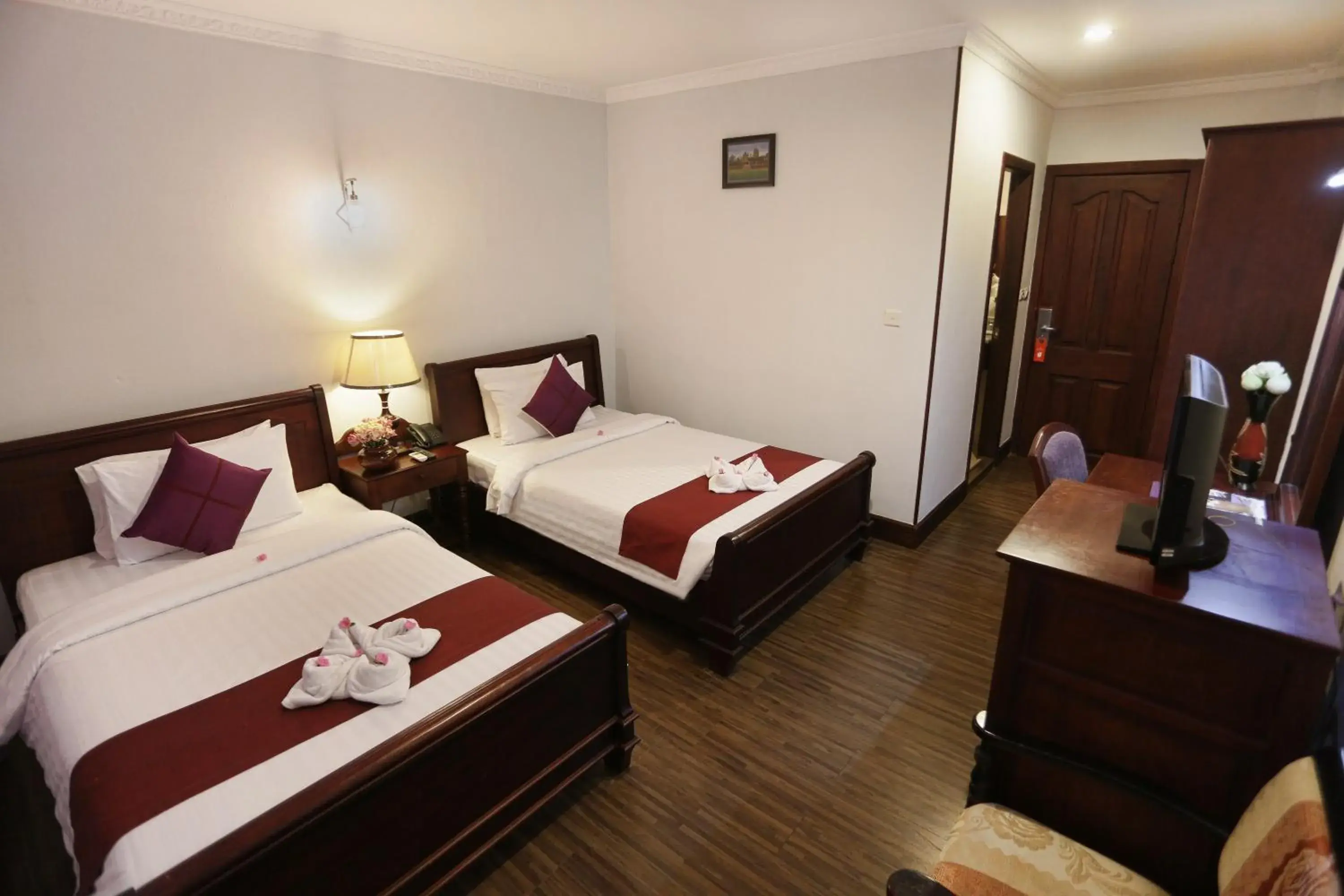 Bed in Lucky Angkor Hotel & Spa Bed in Lucky Angkor Hotel & Spa