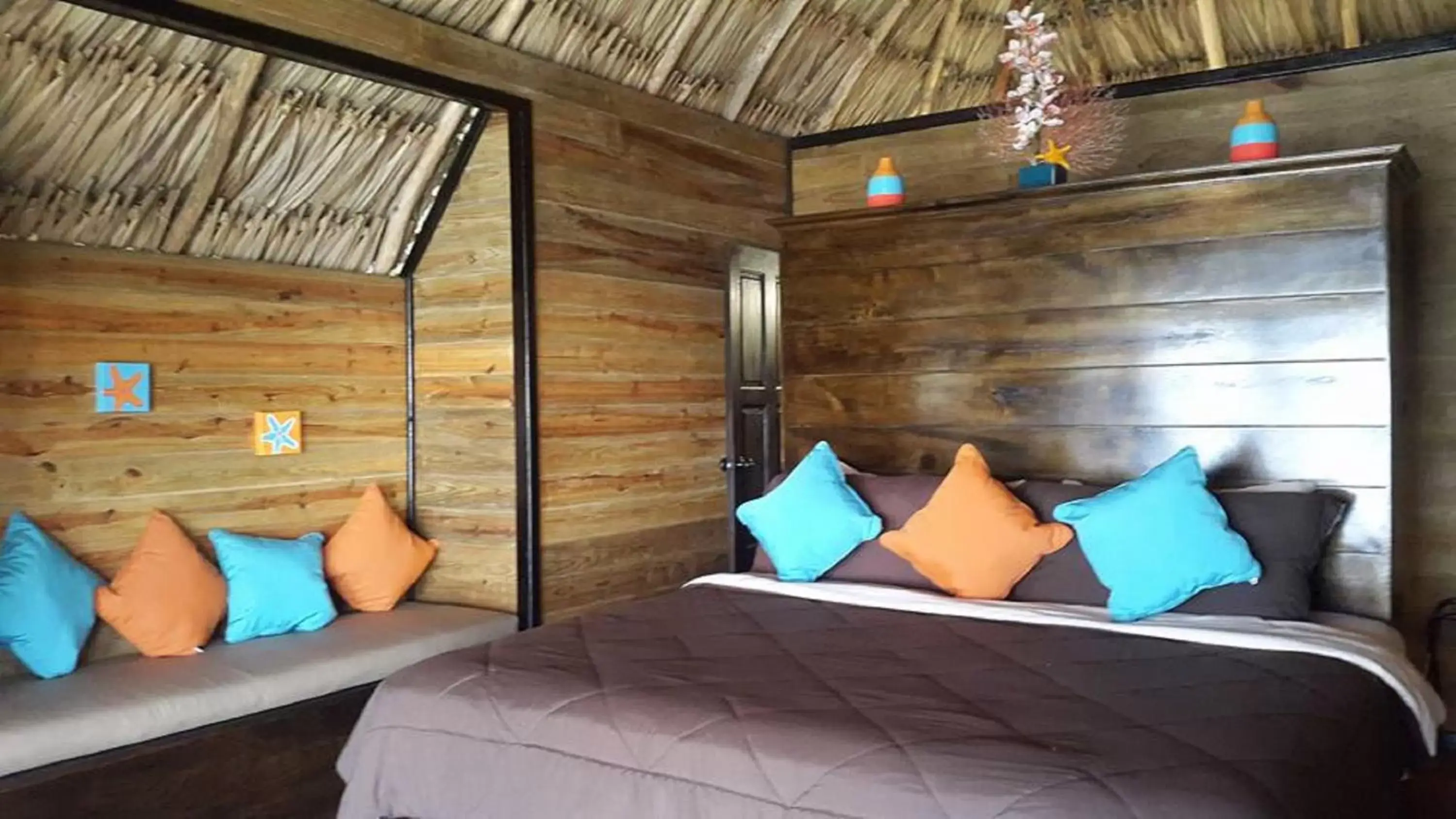 Bed in Lina Point Belize Overwater Resort