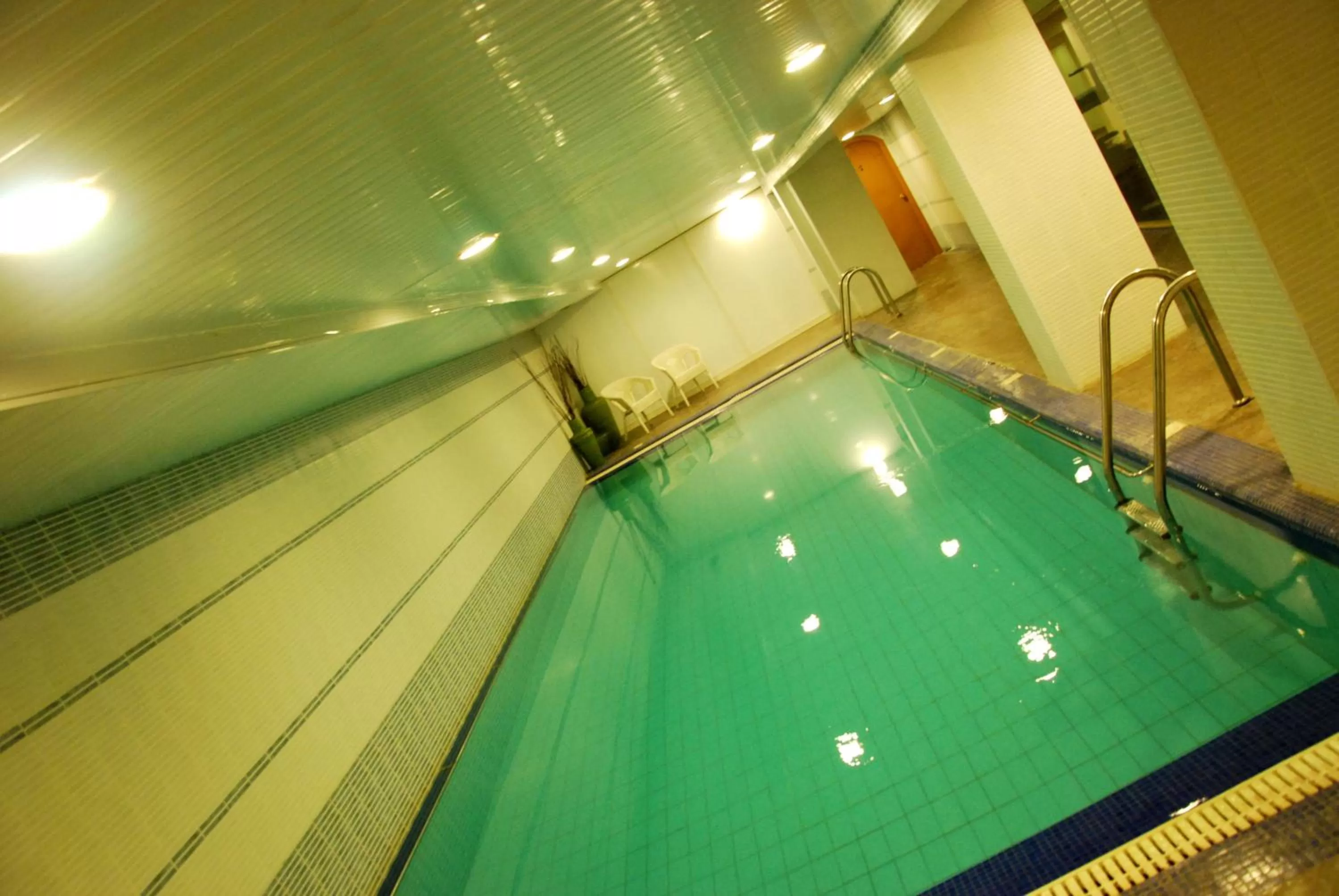 Swimming pool in The Convention Center & Royal Suites Hotel