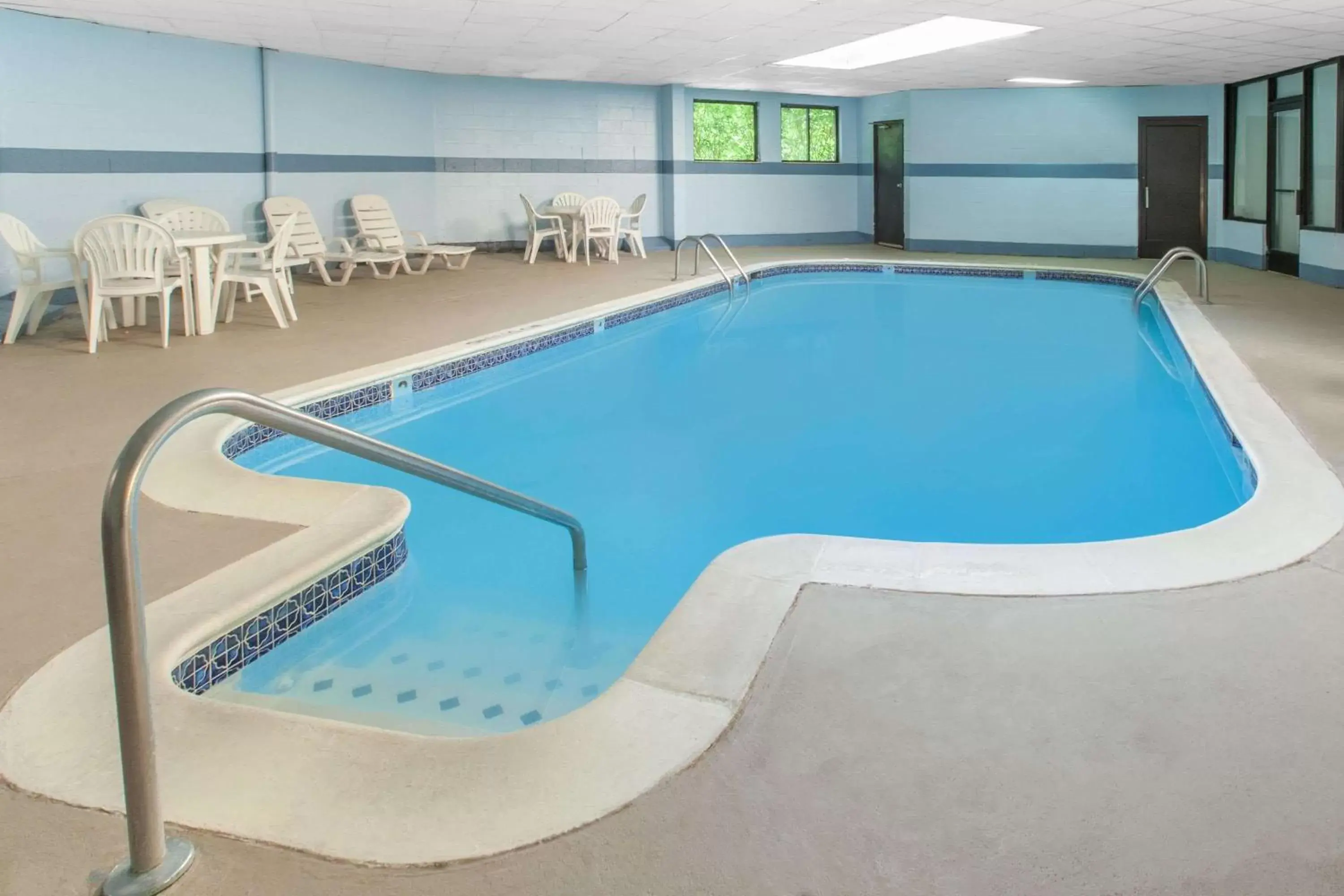 On site, Swimming Pool in Days Inn & Suites by Wyndham Madison Heights MI