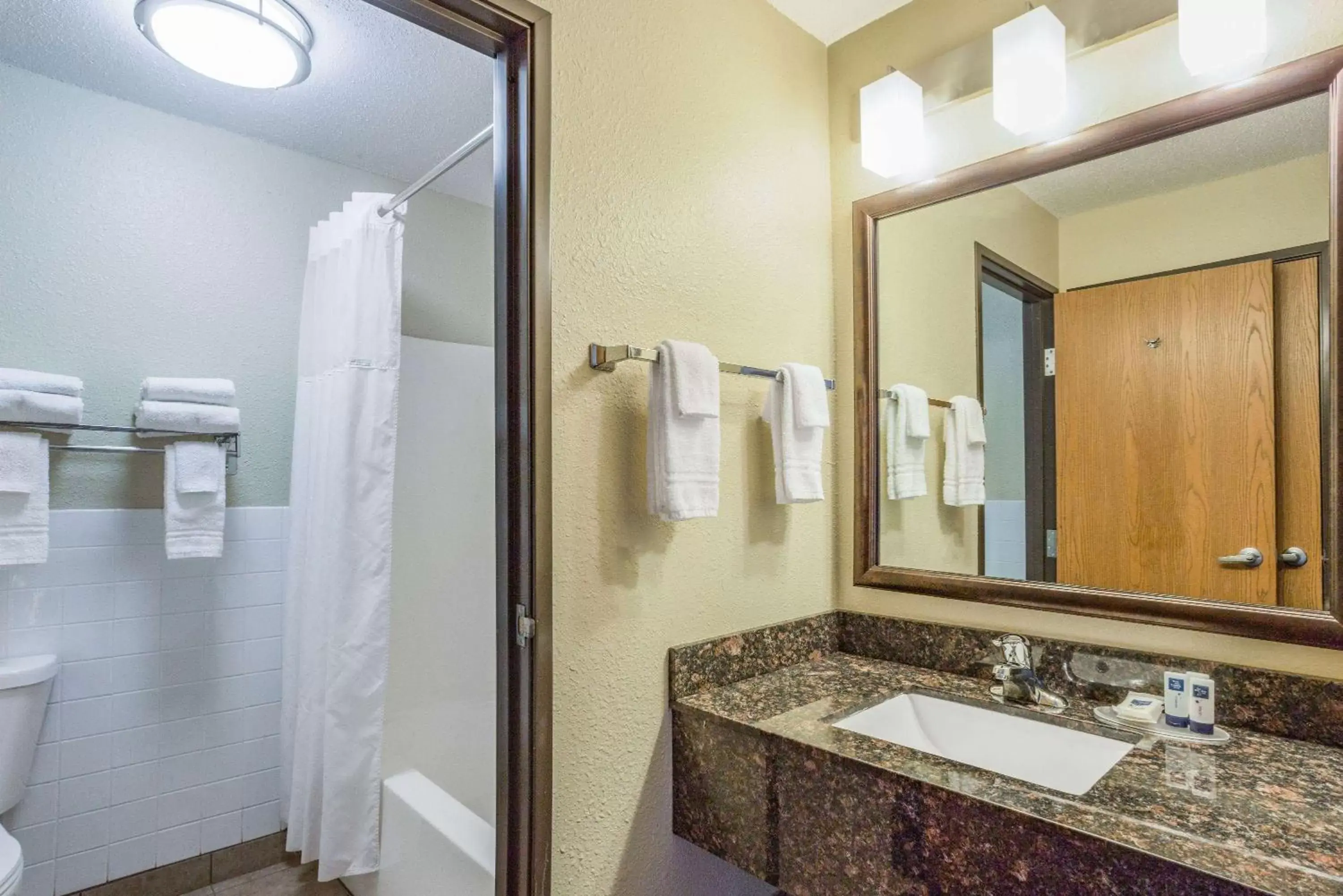 Bathroom in AmericInn by Wyndham Menomonie