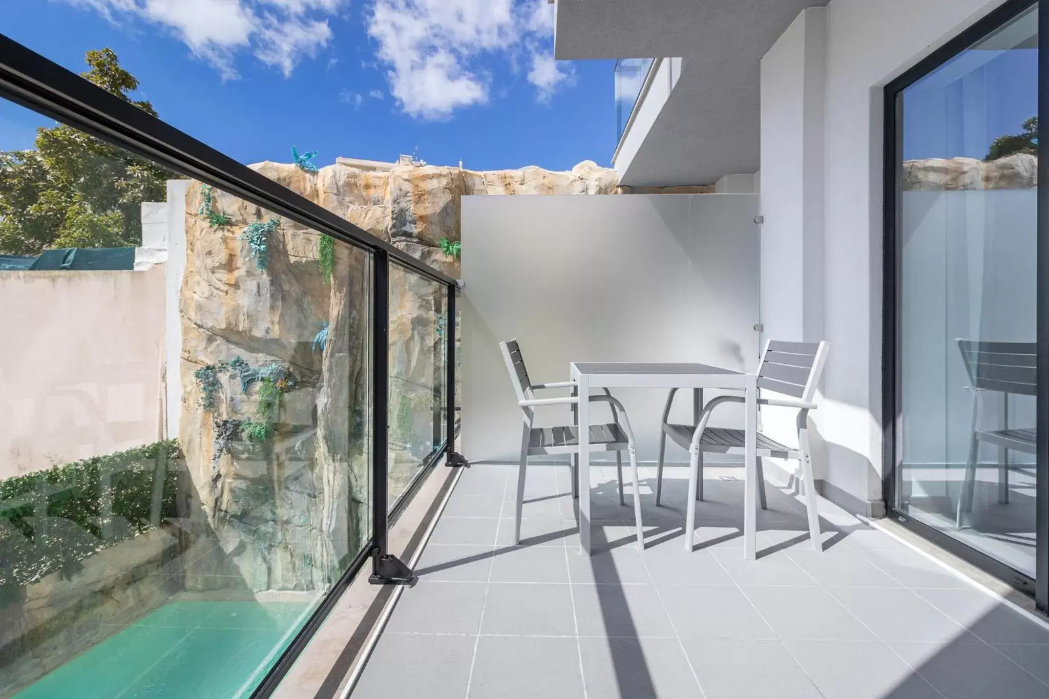 Balcony/Terrace, Swimming Pool in Roots Hotel