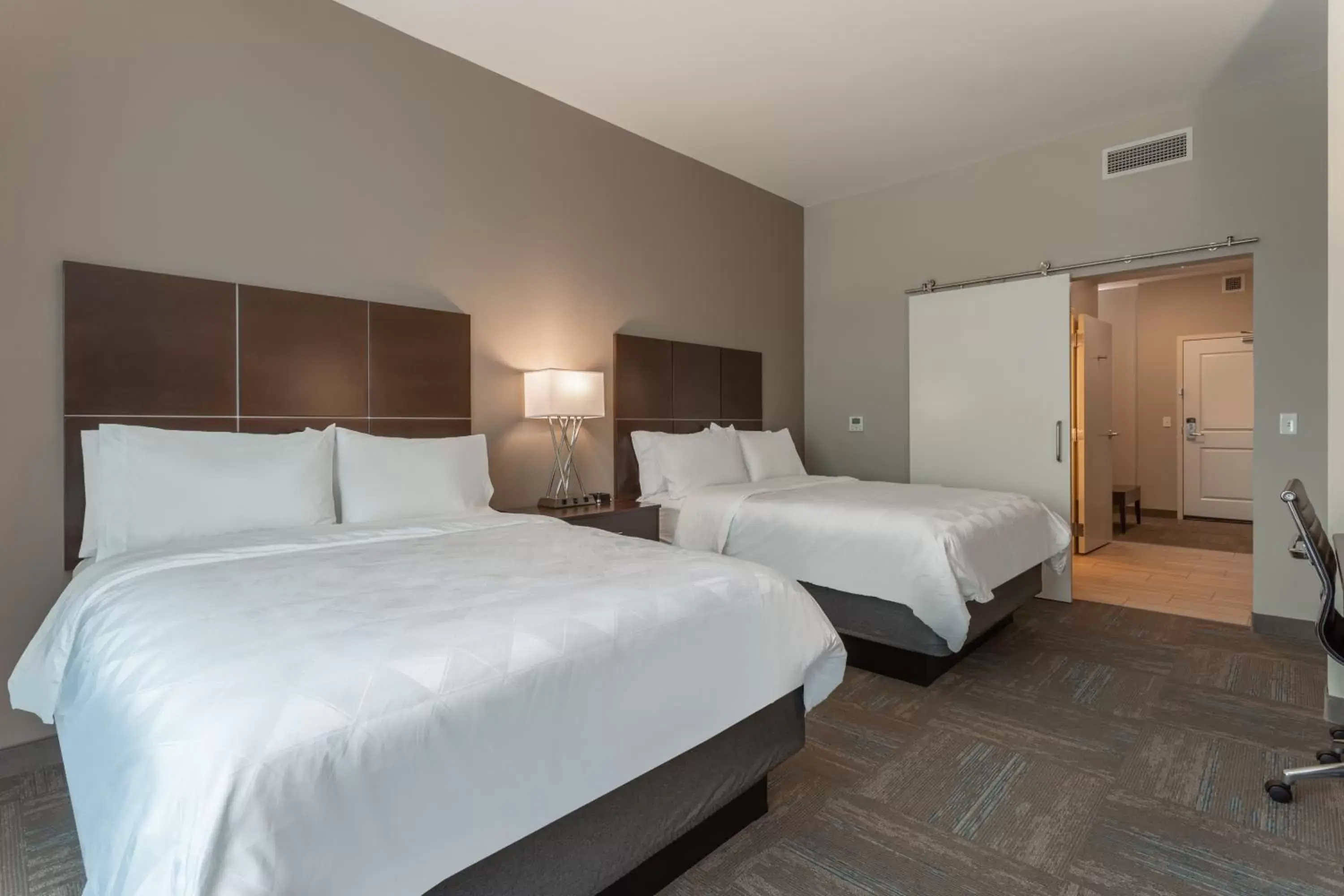 Bed in Holiday Inn & Suites - Jefferson City, an IHG Hotel