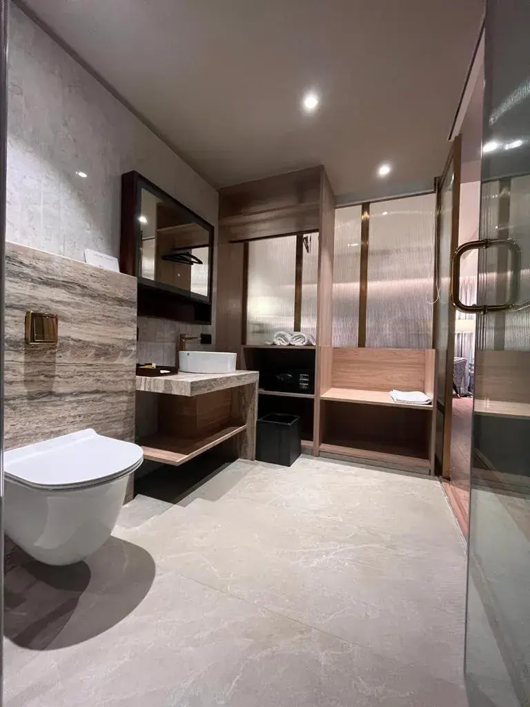 Bathroom in Hotel Poonja International
